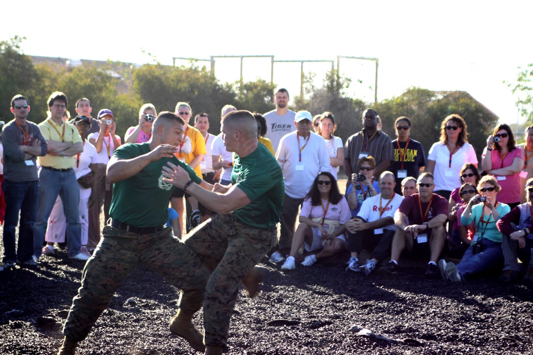Educators from Recruiting Stations Chicago and Twin Cities view a Marine Corps Martial Arts Program demonstration aboard Marine Corps Recruit Depot San Diego, Jan. 18. The Educators Workshop Program allows educators from west of the Mississippi River to visit San Diego and get a view of the Corps.
