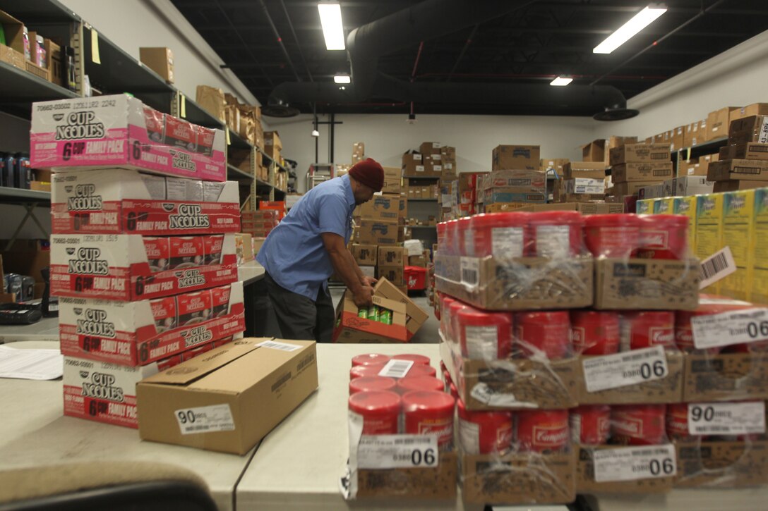 Sid Teo, a store worker at the Combat Center’s new Marine Corps Exchange at Camp Wilson, prepares boxes and stores for inventory Jan. 19, 2011, in the loading area of the new exchange. The exchange opened its doors Jan. 14, here.