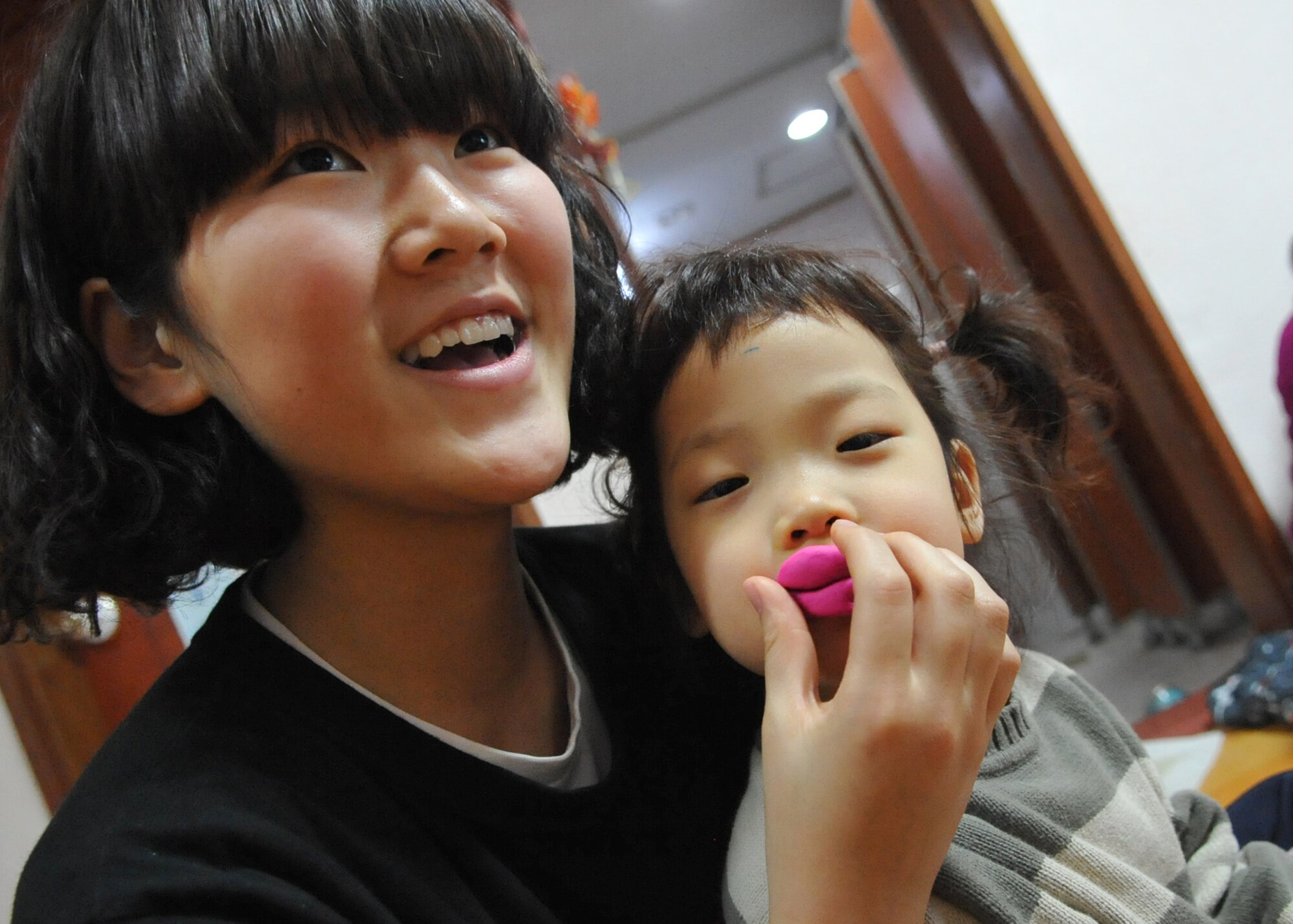 Children at the Cheonan orphanage play with toys during an orphanage trip by Osan Airmen Jan. 15.  The Osan base chapel organizes a monthly trip to local orphanges, where volunteers have the opportunity to play and talk to the children. (U.S. Air Force photo by Senior Airman Evelyn Chavez)