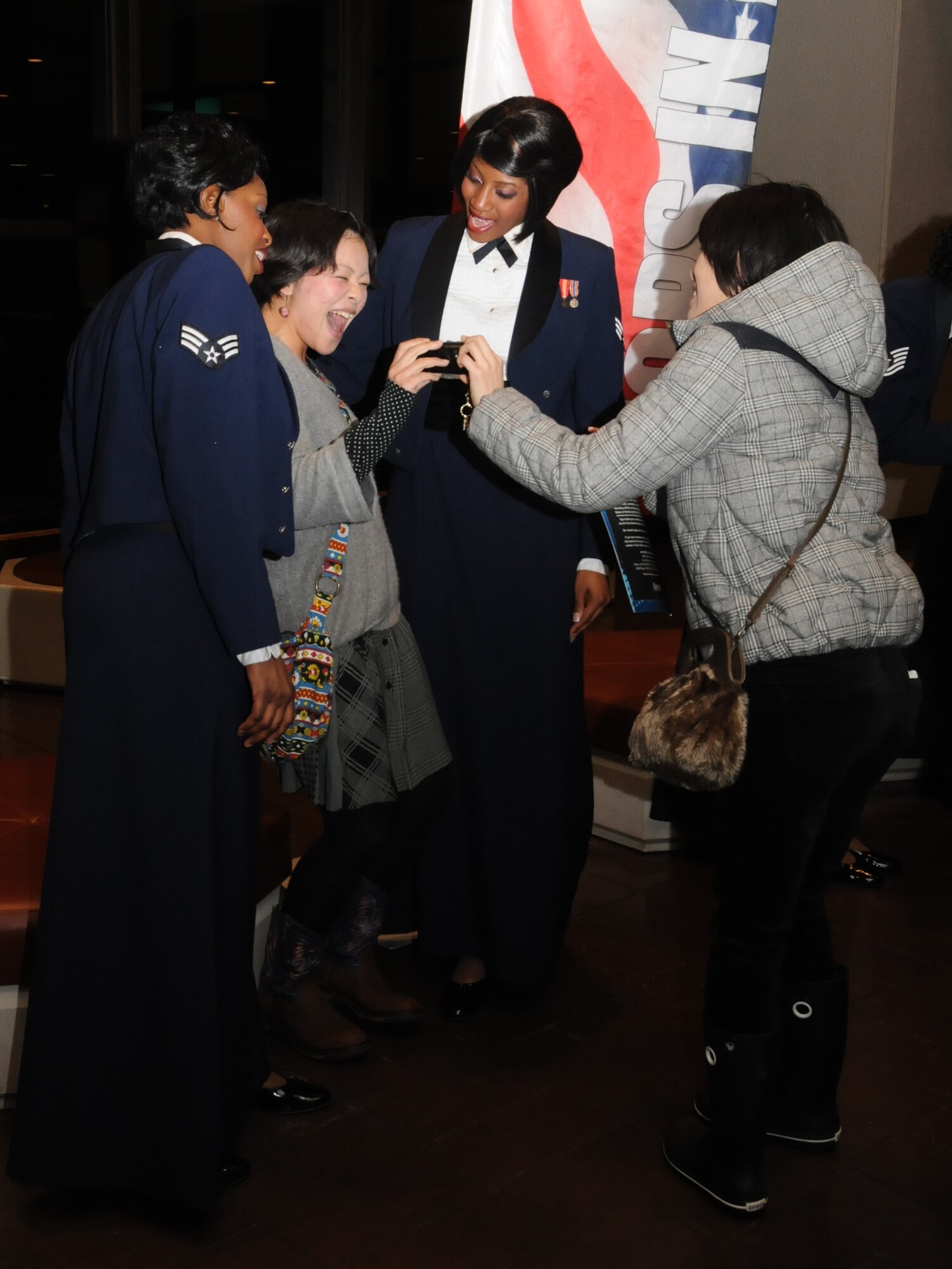 Audience members meet and greet Tops In Blue members following a performance at the Misawa Civic Center Jan. 18, 2011. Tops In Blue will conclude their 2010 world tour in February. (U.S. Air Force photo by Staff Sgt. Rachel Martinez/Released)