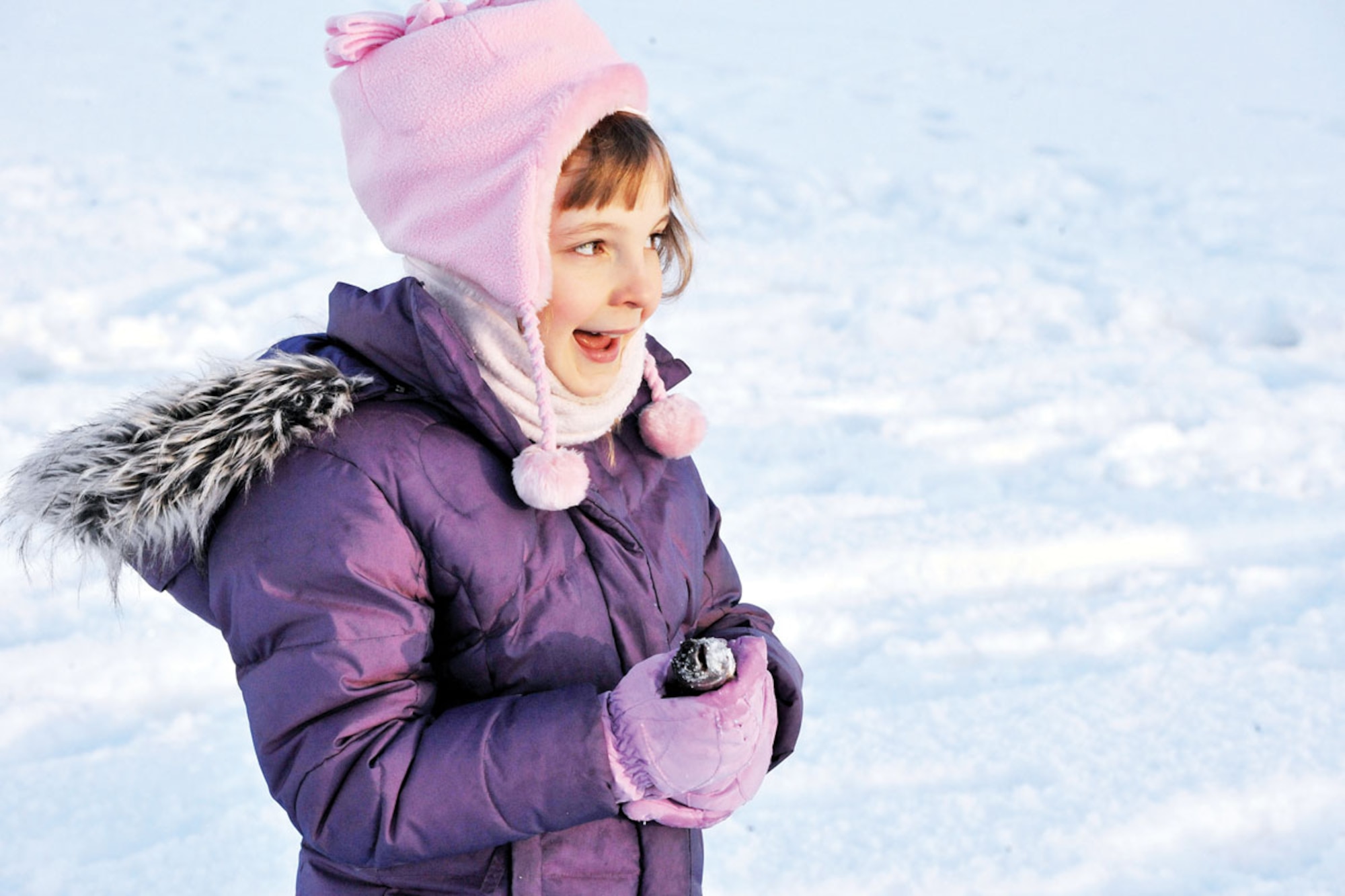 Nine year old Elizabeth Erickson, daughter of Air Force Master Sgt. Jeremiah Erickson, 673d Air Base Wing, carries her freshly caught fish to the weigh-in station during the annual Hillberg Ice Fishing Tournment, Jan. 8. (U.S. Air Force photo/A1C Jack Sanders)