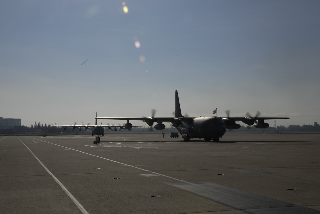 Two MC-130P Combat Shadow aircraft based with the 129th Resue Wing land at Moffett Federal Airfield, Calif., Jan. 12, 2011.  The aircraft transported 129th Airmen who were deployed in Djibouti to provide combat search and rescue support for Combined Joint Task Force-Horn of Africa. (Air National Guard photo by Tech. Sgt. Ray Aquino)