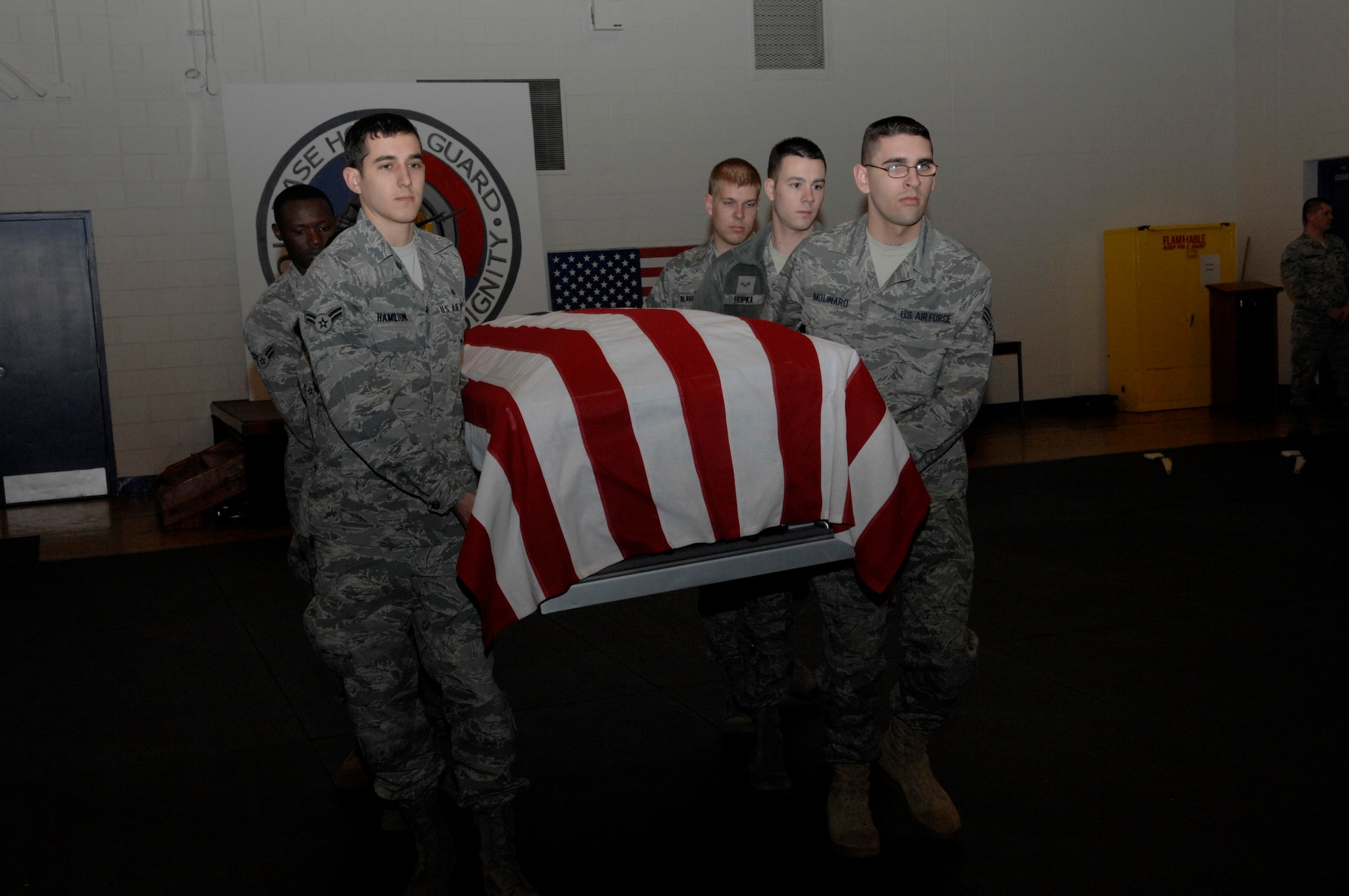 Scott Honor Guard members practice serving in a funeral ceremony.  The Honor Guard serves the third largest area in the Air Force. (U.S. Air Force photo/ Senior Airman Amber R. Kelly-Herard)