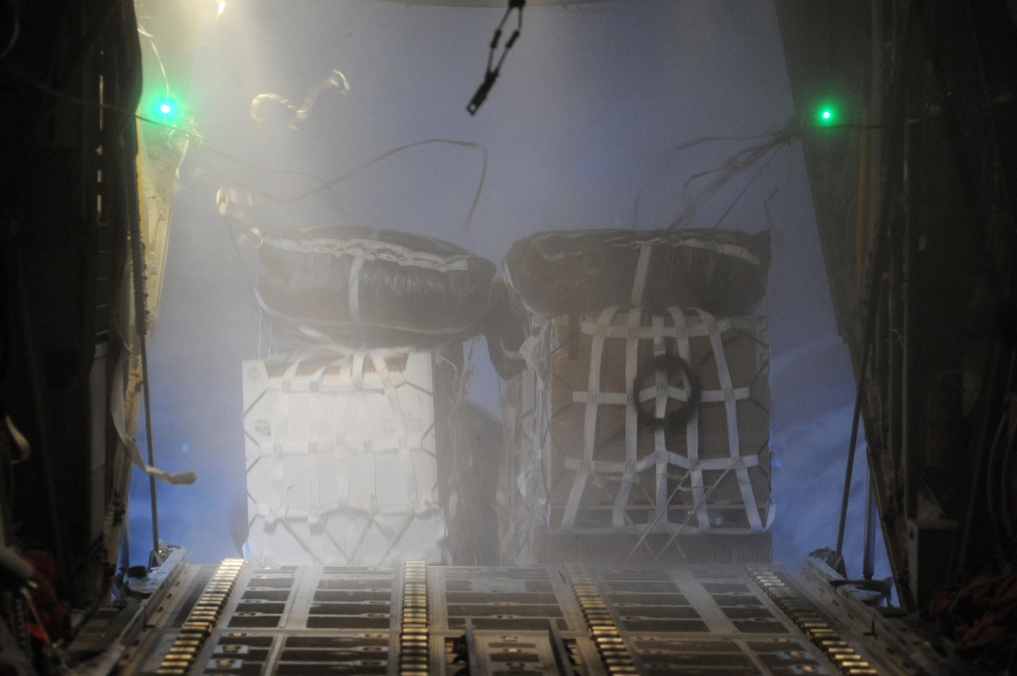 A C-130J Hercules from the 772nd Expeditionary Airlift Squadron releases 16 container delivery system bundles Oct 7, 2010, for a remote, forward-operating base in Afghanistan. The supplies delivered will replenish ground forces with water, food and supplies needed to help sustain their living conditions. (U.S. Air Force photo/Tech. Sgt. Chad Chisholm) 