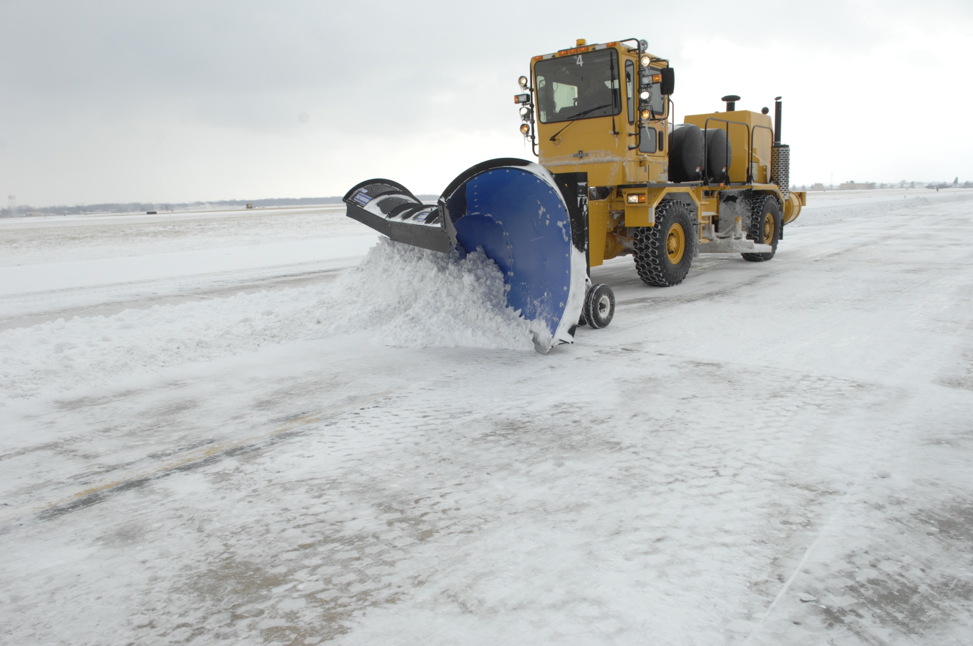 Randy McGeehan, 375th Civil Engineer Squadron, plows snow on the flightline Jan. 11. The 375th CES has a dedicated crew that works constantly on the flightline, starting with the Mid-America Airport side and then moving to the Scott side. (U.S. Air Force photo/ Senior Airman Amber R. Kelly-Herard)