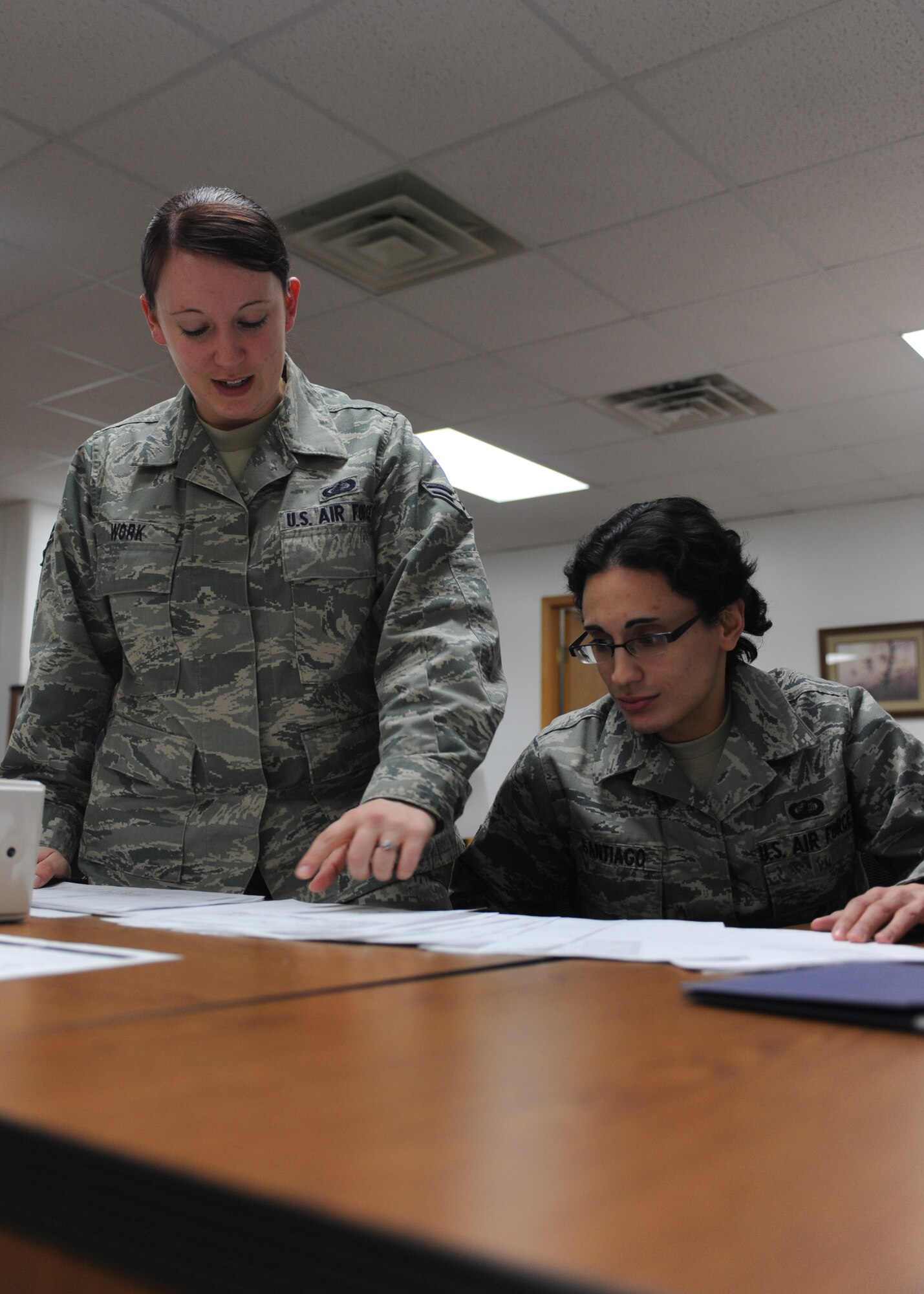 MINOT AIR FORCE BASE, N.D. -- Airman 1st Class Ashley Work, 5th Comptroller Squadron budget analyst, instructs Airman 1st Class Saiomy Santiago, 5th CPTS financial analysis technician on assignments needed for completion Jan. 19. As Airman Santiago’s trainer and sponsor, Airman Work made a great effort to ensure her apprentice received the best training possible. Airman Santiago noted staying in touch with her sponsor from early on really helped her know what to expect when she arrived here. (U.S. Air Force photo/Airman 1st Class Aaron-Forrest Wainwright) 