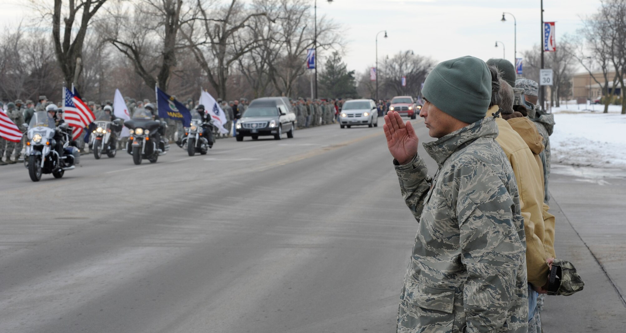 McConnell Airmen salute fallen U.S. Army Staff Sgt. Eric Nettleton Jan. 14, 2011, McConnell Air Force Base, Kan. Sergeant Nettleton’s remains were flown into McConnell where they were received by his family to include his brother, Senior Airman Clayton Nettleton, 22nd Logistic Readiness Squadron storage and issue technician. (U.S. Air Force photo/Airman 1st Class Armando A. Schwier-Morales)
