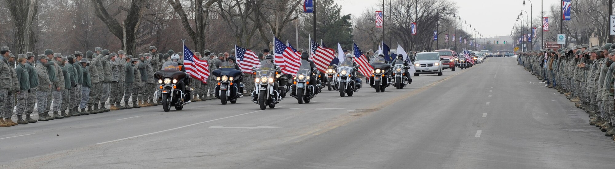Approximately 600 Airmen lined the streets to pay respect to a fallen servicemember, Jan 14, 2011, McConnell Air Force Base, Kan. U.S. Army Staff Sgt. Eric Nettleton’s remains were transported to McConnell from Dover Air Force Base, Del. The family was escorted by the Kansas Patriot Guard Riders. (U.S. Air Force photo/Airman 1st Class Armando A. Schwier-Morales) 