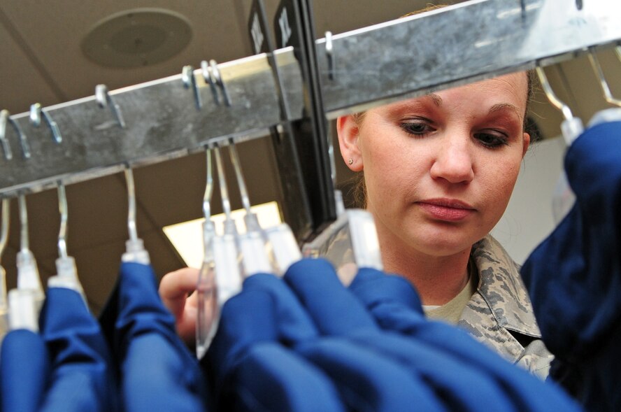 Staff Sgt. Jessica Chebaro, 2nd Bomb Wing protocol, shops for new physical training gear at the military clothing sales store located on Barksdale Air Force Base, La., Jan. 19. The new PT gear that was approved by Air Force Chief of Staff Gen. Norton Schwartz in April 2009 is the new and improved version of its predecessor based on Airman feedback. To enhance ventilation, the new design is made with a softer, nylon fabric that wicks moisture and breathes better, similar to exercise gear sold at off-base retailers. (U.S. Air Force photo/Senior Airman Joanna M. Kresge)