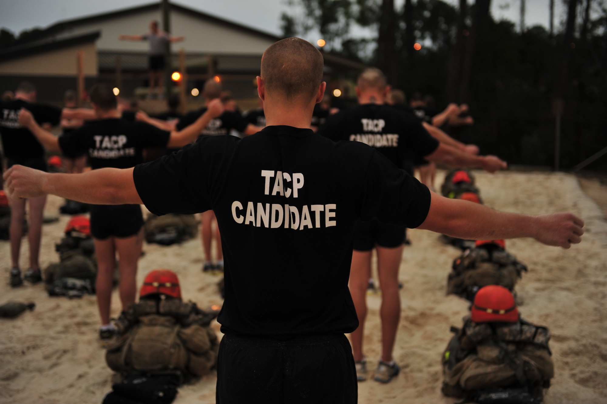 U.S. Air Force Tactical Air Control Party class Falcon 86 performs arm rotations during its first physical training session, Hurlburt Field, Fla., Jan. 5, 2011. The TACP technical training school involves rigorous academic and physical training standards. TACPs establish and maintain command and control communications, control air traffic and naval gunfire and provide precision terminal attack guidance of U.S. and coalition close air support. (U.S. Air Force photo by Staff Sgt. Stephanie Jacobs/RELEASED)


