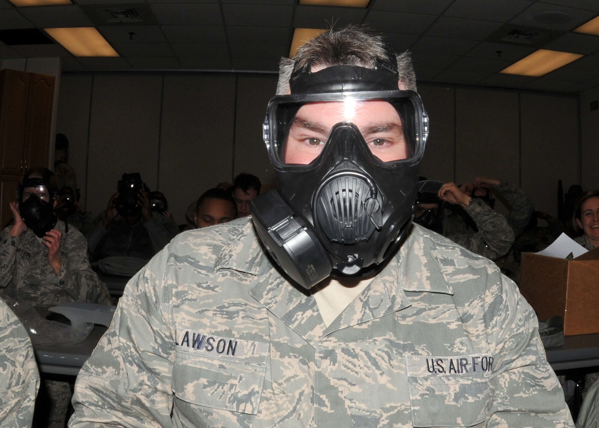 914th Airlift Wing member Senior Master Sgt. Keith Lawson being issued and trained in the basics of the new M50 Joint Service General Purpose Mask January 9 2011 Niagara Falls Air Reserve Station, Niagara Falls, NY. The M50 Joint Service General Purpose Mask will be the standard for the United States armed Forces. (U.S. Air Force photo by Staff Sgt. Joseph McKee)