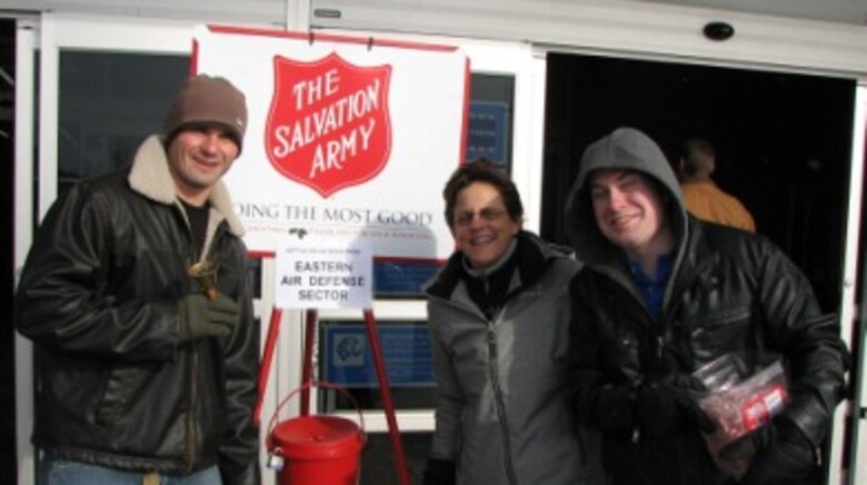 Staff Sgt Shane Hastings, Senior Master Sgt Maureen Dooley and Airman 1st Class Joshua Ivey rang the bell for The Salvation Army's Red Kettle Drive. More than 40 EADS volunteers supported the effort. 