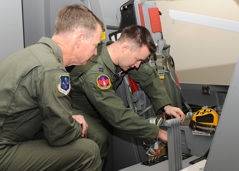 DYESS AIR FORCE BASE, Texas – Capt. Matthew Steele, 7th Operations Support Squadron, goes over emergency ejection procedures with Lt. Gen. Glenn Spears, 12th Air Force commander, for aircrew life support training Jan. 19 here. The operations support squadron directs wing flight operations, conventional mission planning, combat tactics, airfield management, aircrew training, exercise scheduling, aircraft scheduling, weapons and tactics standardization, intelligence integration, war plans, deployment planning, weather support, small computer support, simulator training, air traffic control and wing life support functions. (U.S. Air Force Photo/Airman 1st Class Chelsea L. Cummings)