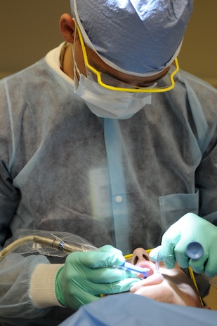 Hospital Corpsman Seaman Jordan Craig uses a polishing tool to place fluorinated paste onto a patient’s teeth. This process is done after completing an annual cleaning where a doctor will remove plaque and tarter from hard to reach areas. (U.S. Navy photo/Mass Communication Specialist 1st Class Jennifer R. Hudson)