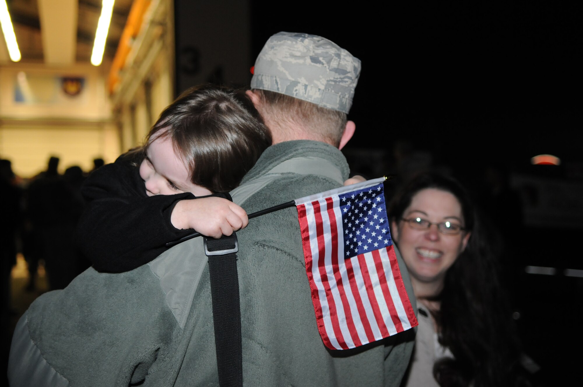 SPANGDAHLEM AIR BASE, Germany –Staff Sgt. Ryan Baldner, 606th Air Control Squadron weapons director, receives a warm welcome from his daughter Abby after returning home from his deployment Jan 17. Seventy-one Airmen from the 606th ACS returned from multiple locations in the U.S. Central Command area of responsibility. Family members and fellow servicemembers waited to greet the Airmen upon their return after 6- and 7-month deployments. (U.S. Air Force photo/Airman 1st Class Matthew B. Fredericks)
