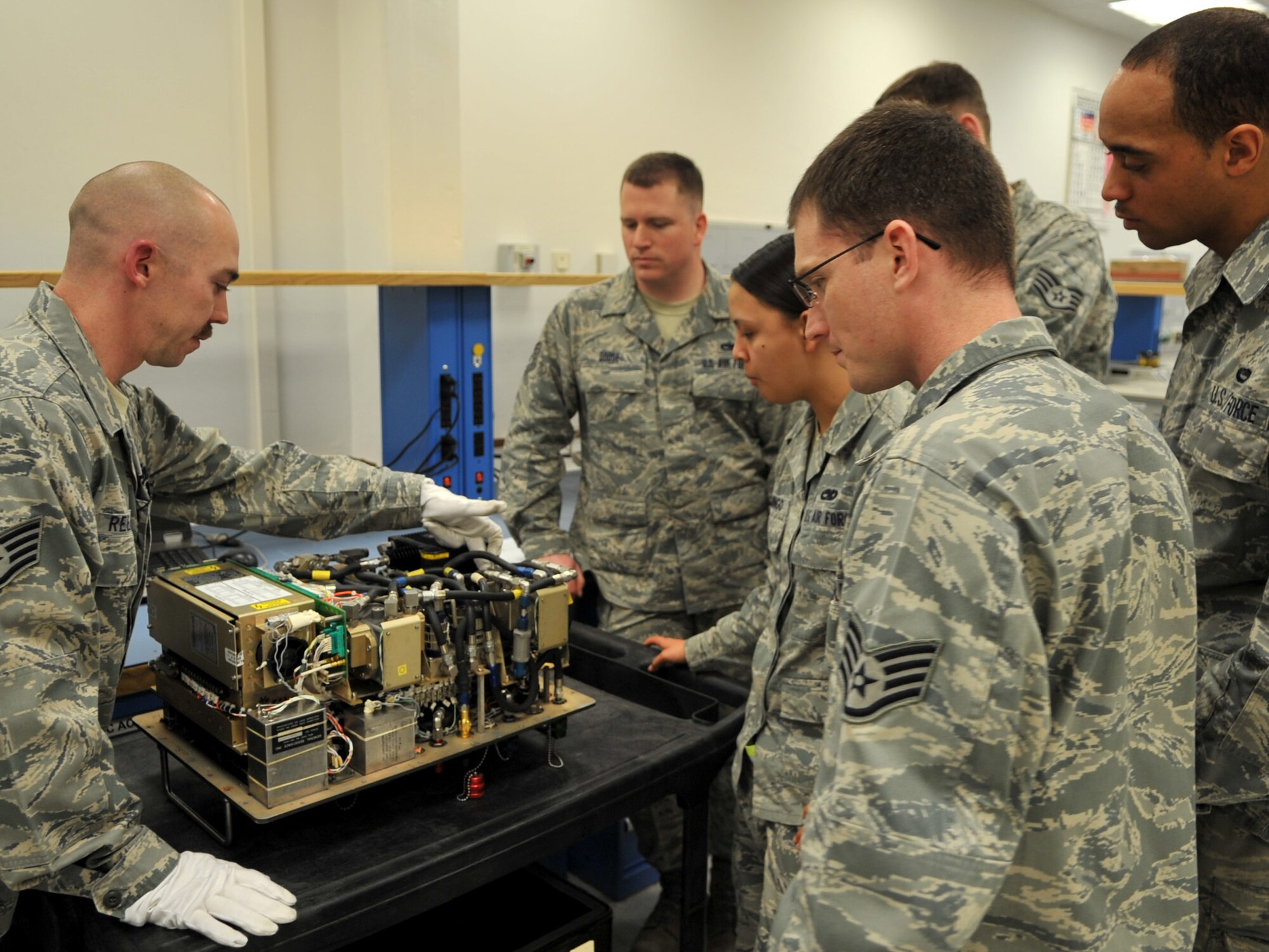U.S. Air Force Staff Sgt. Stephen Reesman, 86th Maintenance Squadron Test Measurement and Diagnostic flight technician, gives familiarization training to maintenance members, Ramstein Air Base, Germany, Jan. 19, 2010. The flight consists of a scheduling section, shipping and receiving section, administration section and the Precision Measurement Equipment Laboratory (PMEL) and services customers throughout United States Air Forces in Europe, United States Central Command, and United States Africa Command. (U.S. Air Force photos by Senior Airman Caleb Pierce)