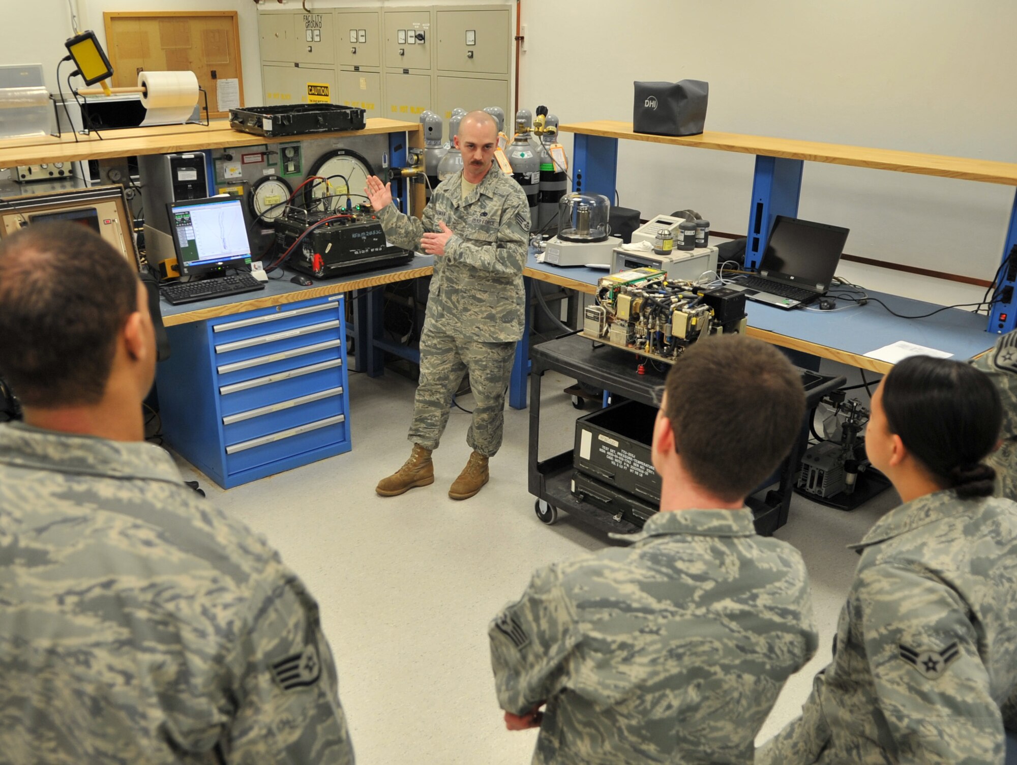 U.S. Air Force Staff Sgt. Stephen Reesman, 86th Maintenance Squadron Test Measurement and Diagnostic flight technician, gives familiarization training to maintenance members, Ramstein Air Base, Germany, Jan. 19, 2010. The flight consists of a scheduling section, shipping and receiving section, administration section and the Precision Measurement Equipment Laboratory (PMEL) and services customers throughout United States Air Forces in Europe, United States Central Command, and United States Africa Command. (U.S. Air Force photos by Senior Airman Caleb Pierce)