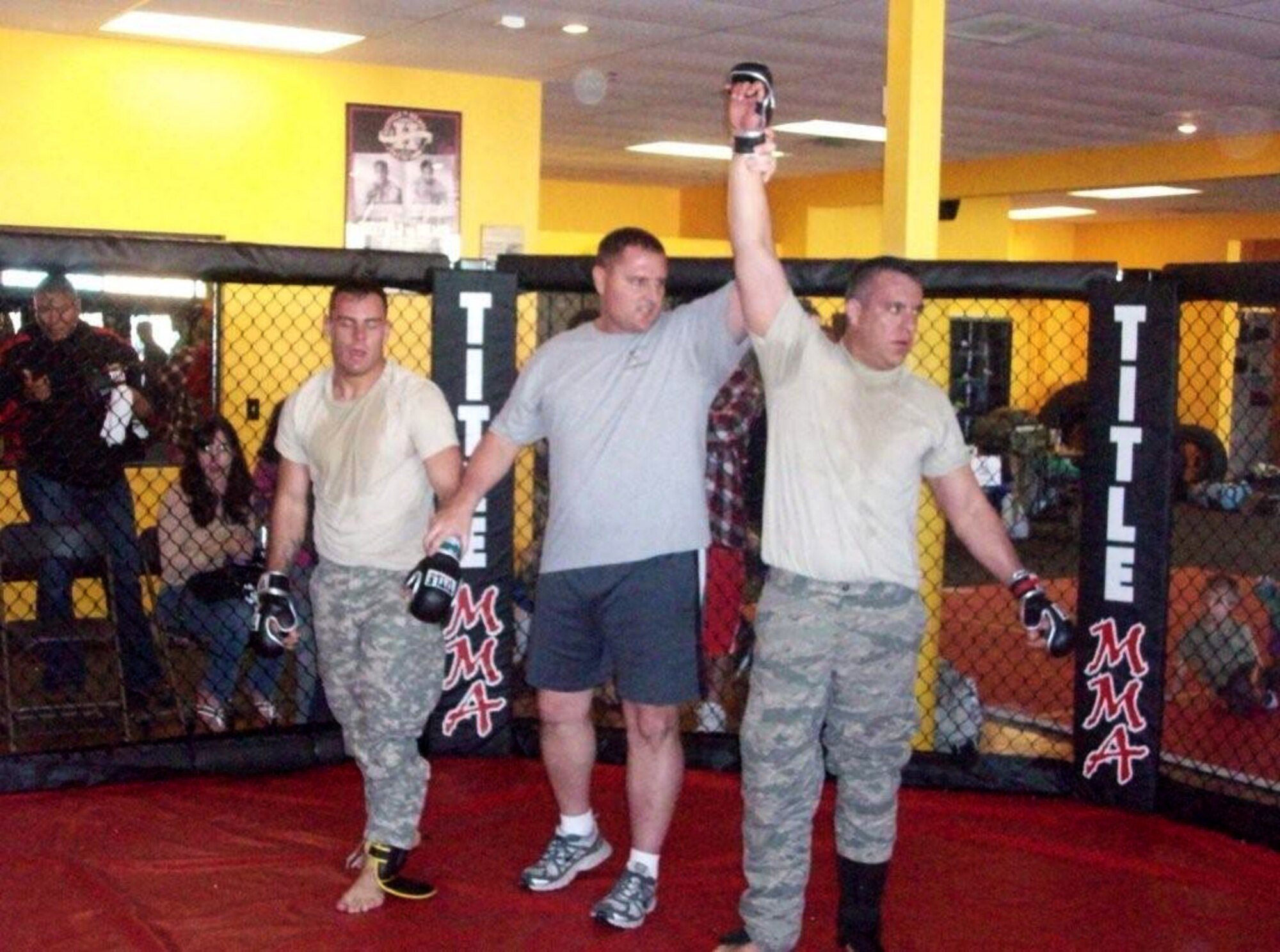 Senior Airman Ed Small, right is declared the victor in his final Mixed Martial Arts match at the Arizona National Guard Combatives Team tryouts Jan. 15. He won a place on the team and the light heavyweight division at 205 pounds. Small, an aircraft maintainer at the 162nd Fighter Wing, was the only Airman at the tryouts. (U.S. Air Force photo/Master Sgt. Dave Morgan)