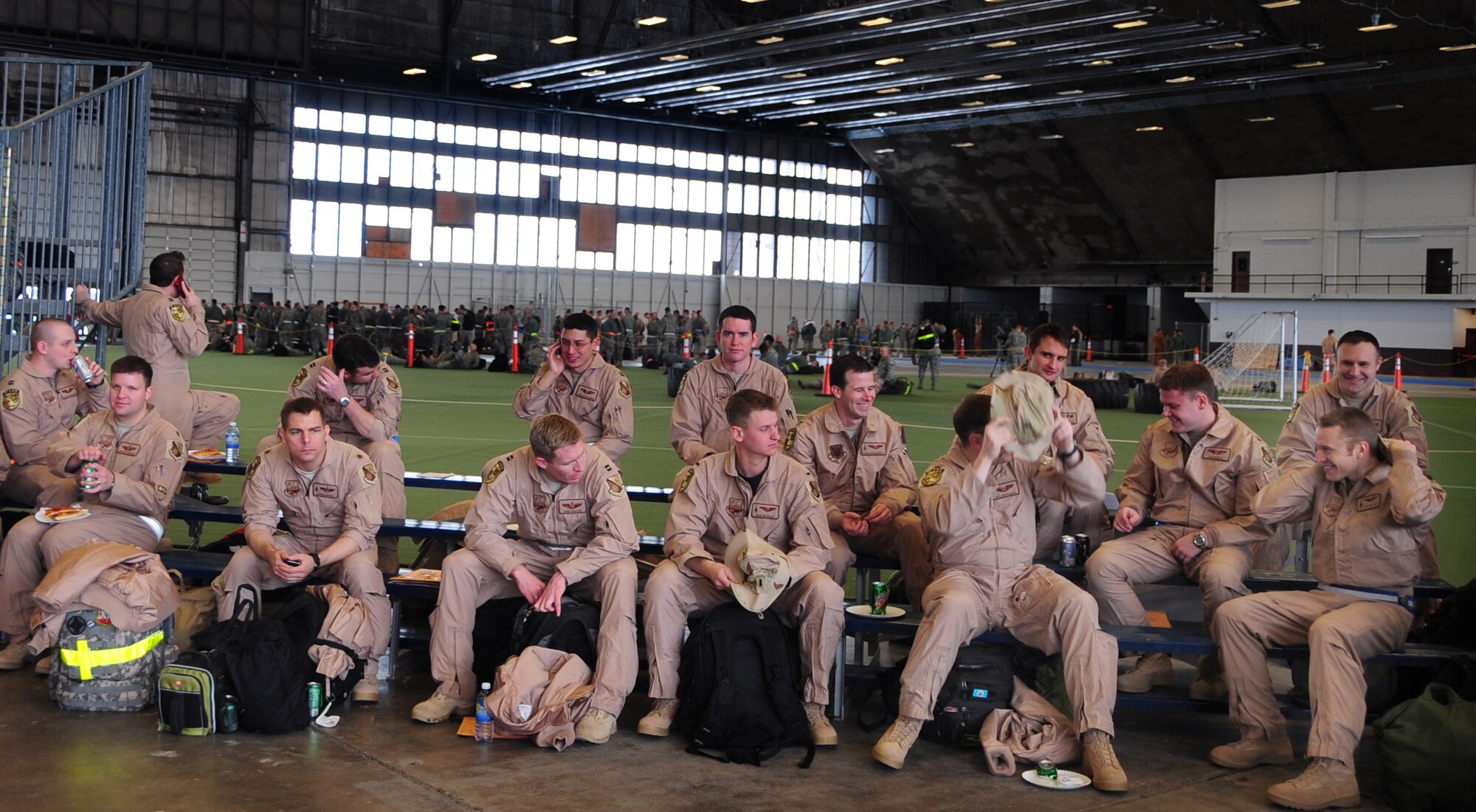 Airmen from Ellsworth Air Force Base, S.D., wait after processing through a deployment line before departing for Southwest Asia, Jan. 15, 2011.  Approximately 300 Airmen deployed in support of overseas contingency operations. (U.S. Air Force photo/Senior Airman Anthony Sanchelli)

