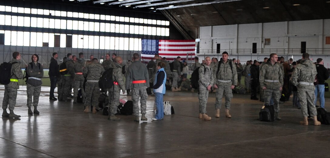 Airmen from Ellsworth Air Force Base, S.D., wait with family and friends before departing for Southwest Asia, Jan. 15, 2011.  Approximately 300 Airmen deployed in support of overseas contingency operations. (U.S. Air Force photo/Senior Airman Anthony Sanchelli)
