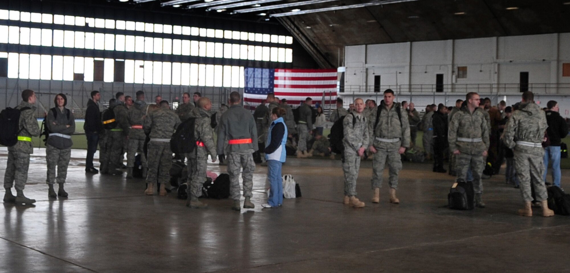 Airmen from Ellsworth Air Force Base, S.D., wait with family and friends before departing for Southwest Asia, Jan. 15, 2011.  Approximately 300 Airmen deployed in support of overseas contingency operations. (U.S. Air Force photo/Senior Airman Anthony Sanchelli)
