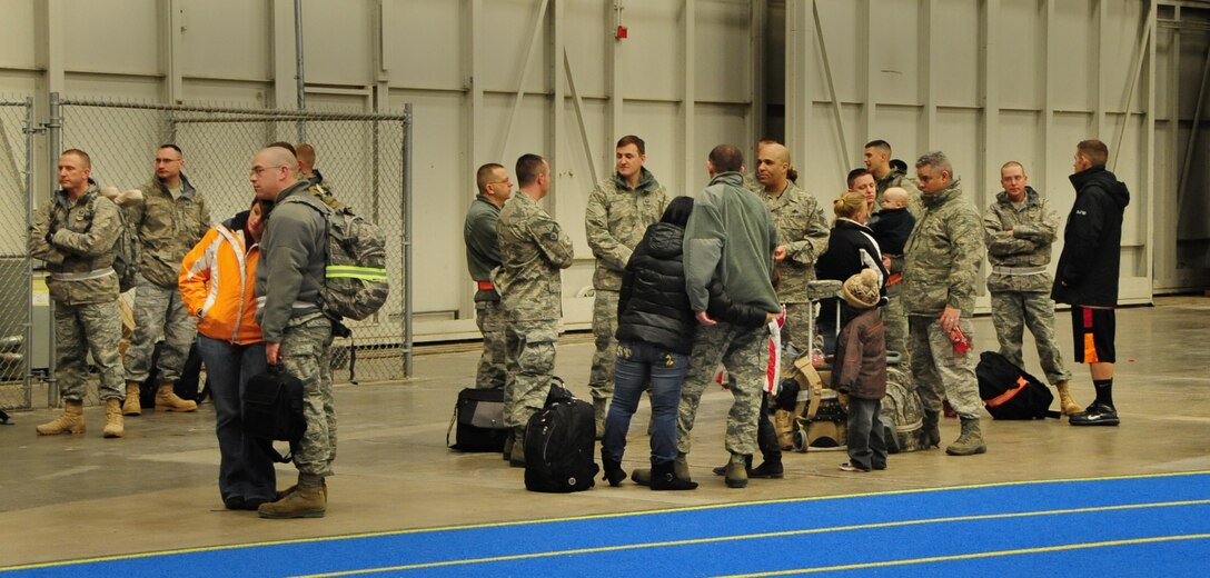 Airmen wait with family and friends before processing through a deployment line at Ellsworth Air Force Base, S.D. on Jan. 12, 2011.  A small group of Ellsworth Airmen deployed in advance of approximately 300 Airmen that deployed to Southwest Asia in support of overseas contingency operations on Jan. 15, 2011. (U.S. Air Force Photo/Senior Airman Anthony Sanchelli)
