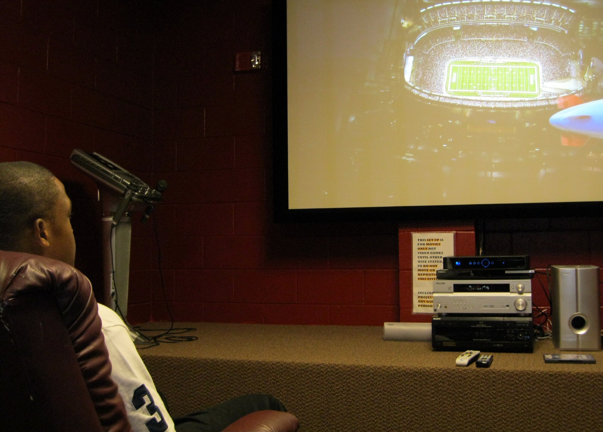 SEYMOUR JOHNSON AIR FORCE BASE, N.C. -- Airman 1st Class Cory Jenkins enjoys an NFL game at the Solid Rock Café Jan. 16, 2010. The SRC, located in the same building as the Southern Eagle Dining Facility, provides Airmen a quality place on base to spend their off-duty time. Airman Jenkins, a native of Slidell, La., is a 334th Aircraft Maintenance Squadron F-15E crew chief. (U.S. Air Force photo/Tech. Sgt. Tammie Moore)