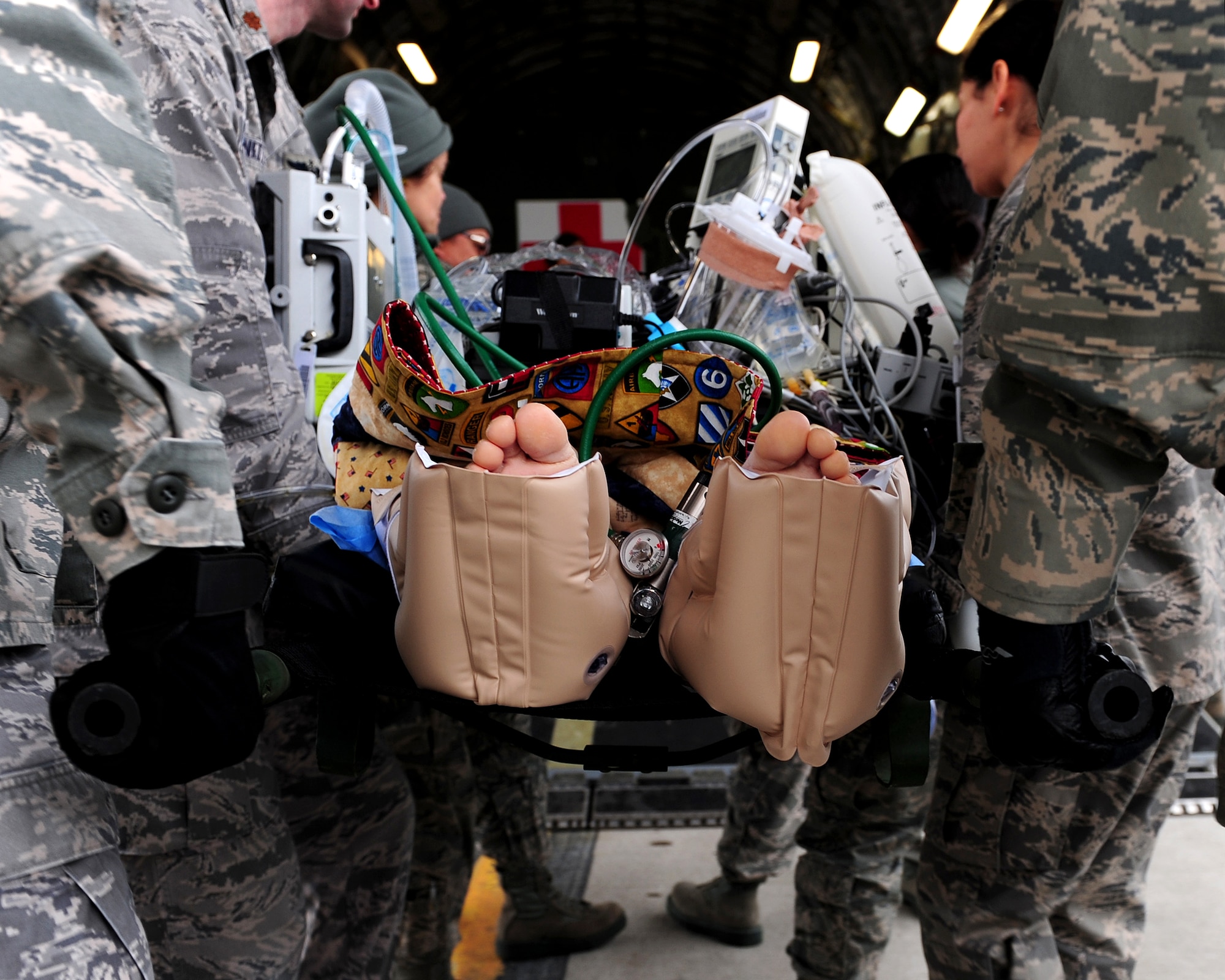 U.S. Air Force personnel from the 908th Aeromedical Evacuation Squadron and four reservists from the 349th Aeromedical Staging Squadron, Travis Air Force Base, Calif., participate in an inbound medical evacuation mission on a KC-135 Stratotanker air-to-air refueling aircraft, Ramstein Air Base, Germany, Jan. 18, 2011. The reservists visited to compare the current Contingency Aeromedical Staging Facility operations to those they established 20 years ago and are now known as pioneers of Ramstein Air Base's CASF operations. (U.S. Air Force photo by Airman 1st Class Brea Miller)