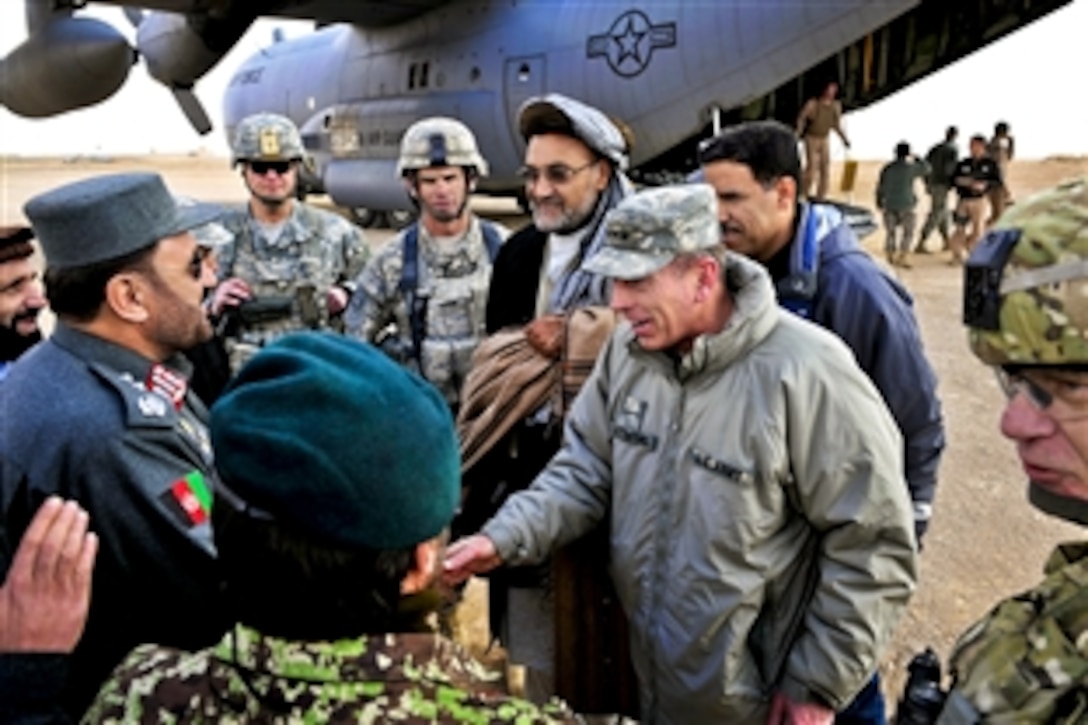 U.S. Army Gen. David H. Petraeus, commander of U.S. and international forces in Afghanistan, and Ashraf Naseri, governor of Zabul province, exchange greetings on Forward Operating Base Lagman, Afghanistan, Jan. 17, 2011.