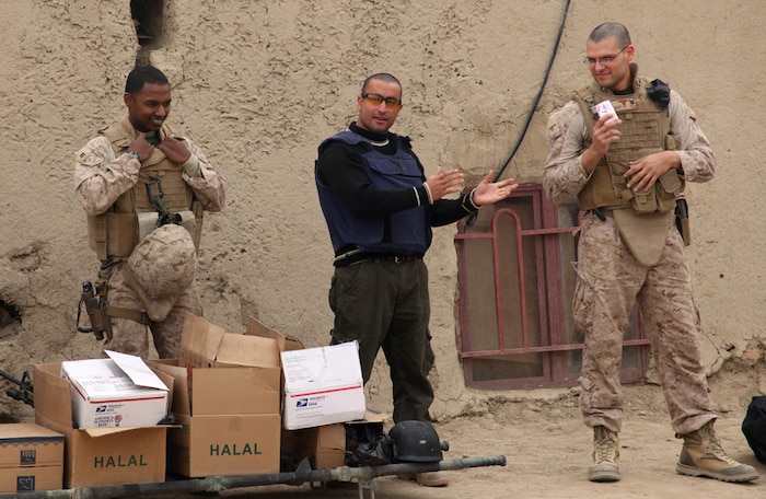 Navy Lt. Alwin Albert, a medical officer, and Petty Officer 3rd Class Robert Herrera, a corpsman, both with Delta Company, 3rd Light Armored Reconnaissance Battalion, 1st Marine Division (Forward) teach Afghan schoolchildren about proper use of soap during a class on hygiene at a local school, Jan. 19, 2011. Marines and sailors gave the class after a local schoolteacher asked them to share proper hygiene techniques with the children.