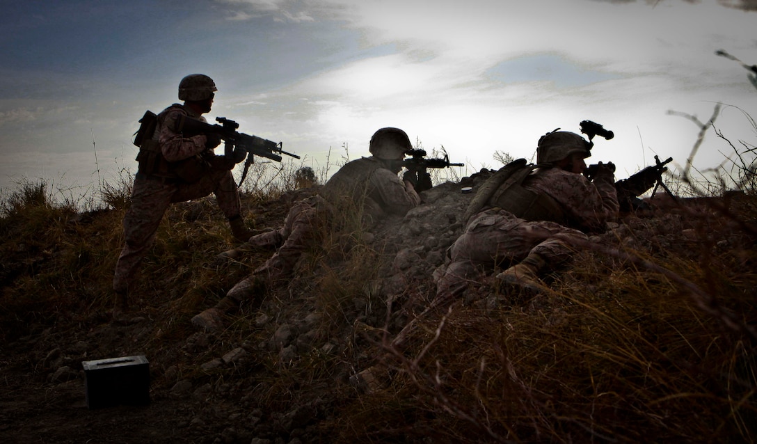 Marines with Combat Logistics Battalion 3, 1st Marine Logistics Group (Forward) provide security for combat engineers during a civil development project in Durzay, Afghanistan, Jan. 21. Following a recent clearing operation in Durzay, Marines are beginning to conduct civil development projects in the area.