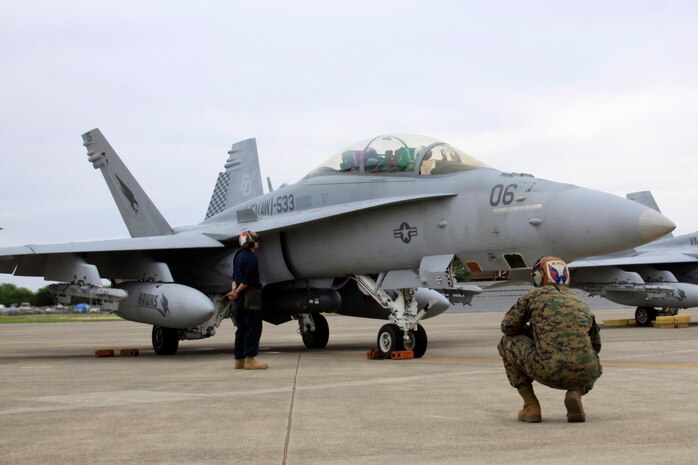 Marine All-Weather Fighter Attack Squadron 533 gets ready to launch an F/A-18D Hornet here Jan. 19 in support of Lava Viper 11.1. The mission of Lava Viper 11.1 is to provide close::r::::n::air support to 1st Battalion, 3rd Marines while simultaneously enhancing and sustaining Marine Aircraft Group 24’s combat readiness, war-fighting capabilities and competencies.
