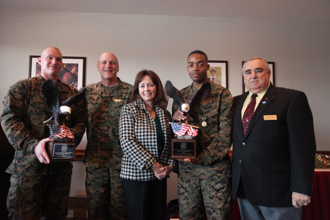 (From left to right) Cpl. Jesse Parke; Maj. Gen. Carl B. Jensen, commanding general of Marine Corps Installations East and his wife, Julie; Sgt. Avery Washington II, and John Reed, take a moment to pose for a photo after the Marine Corps Installations East annual breakfast and awards ceremony at the Ball Center aboard Marine Corps Base Camp Lejeune, Jan. 20. Parke, Washington and Petty Officer 1st Class Julian Esteban (not present), received the Navy and Marine Corps achievement medal and were recognized as the MCIEAST Marine, noncommissioned officer and sailor of the year for 2010.