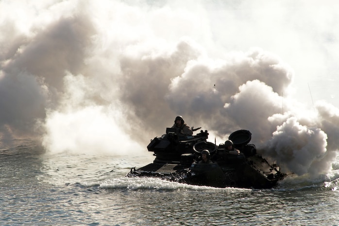 Sgts. Victor Molina, 25, from Los Angeles, Daniel Bailey, 27, from Tennessee, and Christopher Riordan, 27, from Florida, demonstrate the capabilities of an amphibious assault vehicle to teachers and school administrators Jan. 20 during the 2011 Recruiting Station Twin Cities Educators' Workshop. All three Marines are instructors at the Assault Amphibian School Battalion. Thirty-seven educators from Minnesota and North Dakota attended the workshop. For more photos of the event, visit the RS Twin Cities fan page at www.facebook.com/rstwincities.