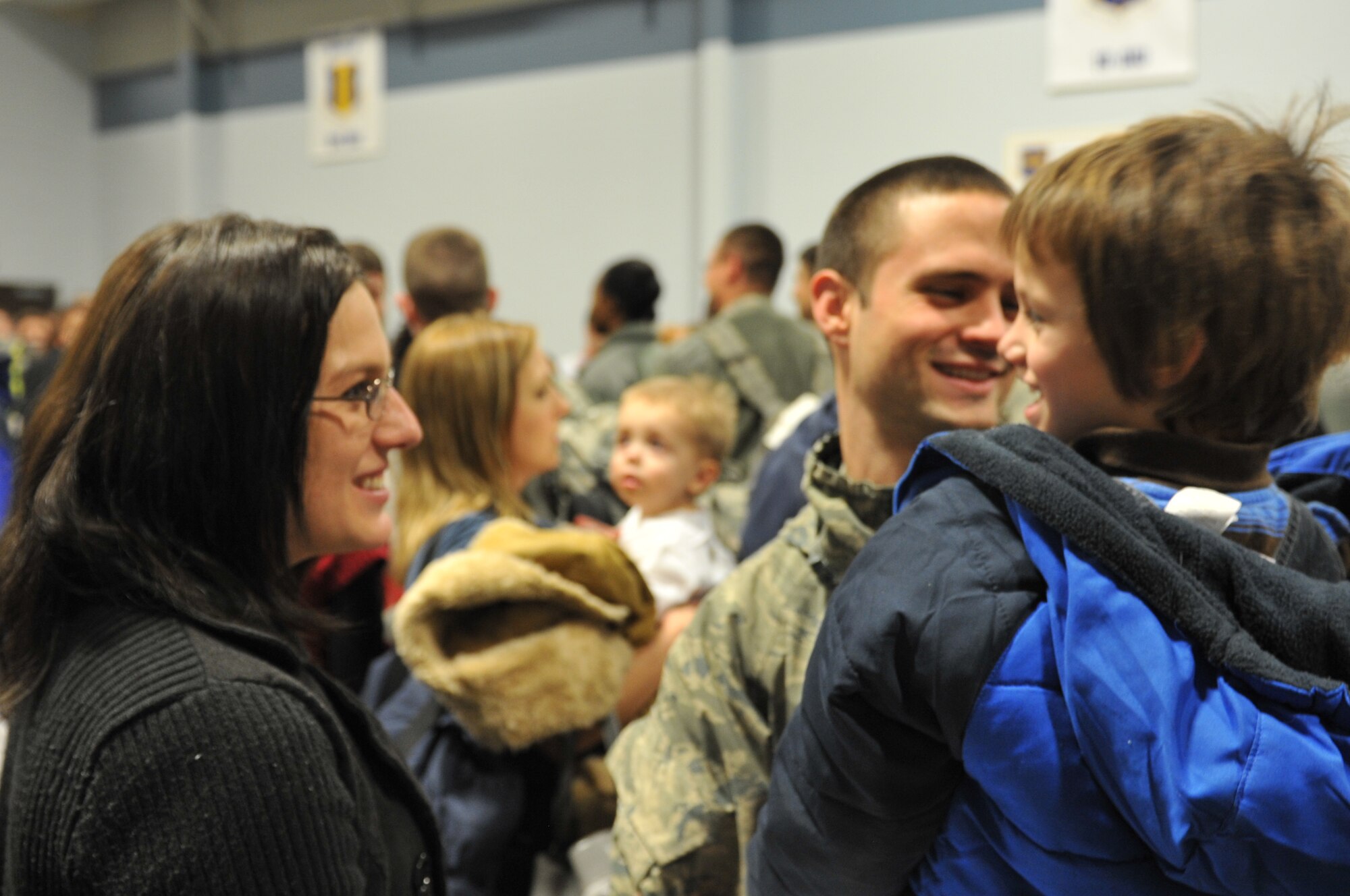 Senior Airman John Thompson, 19th Aircraft Maintenance Squadron crew chief, is greeted by his wife, Sheena; and son, Andy; Jan. 20, 2011, at Little Rock Air Force Base, Ark. Airman Thompson, deployed with 332nd Expeditionary Aircraft Maintenance Squadron, returned home from a five-month deployment from Balad Air Base, Iraq. (U.S. Air Force photo by Airman 1st Class Rusty Frank)