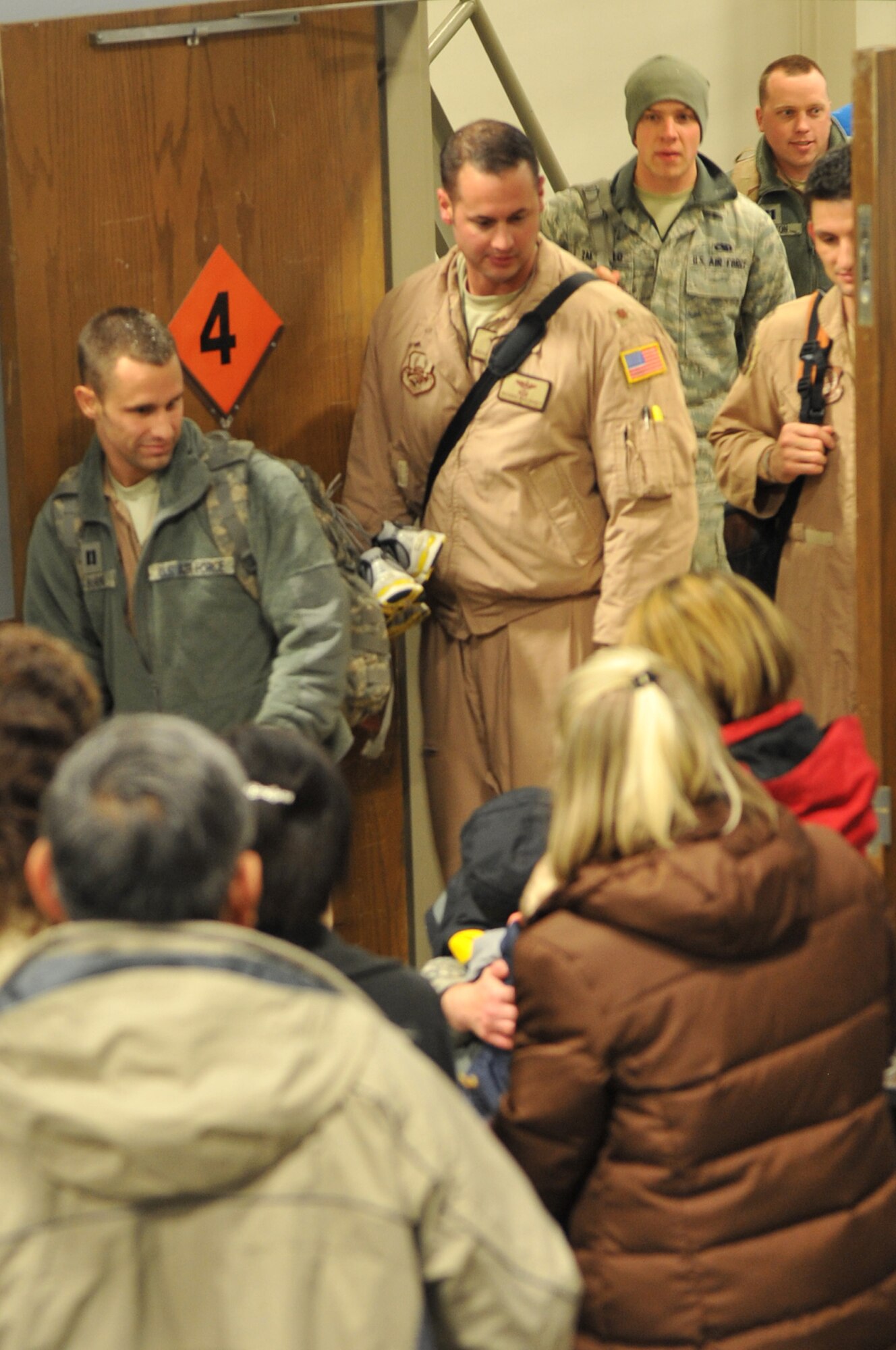 Members of Team Little Rock are greeted by family and friends Jan. 20, 2011, at Little Rock Air Force Base, Ark. The Airmen returned home after their deployments abroad. (U.S. Air Force photo by Airman 1st Class Rusty Frank)