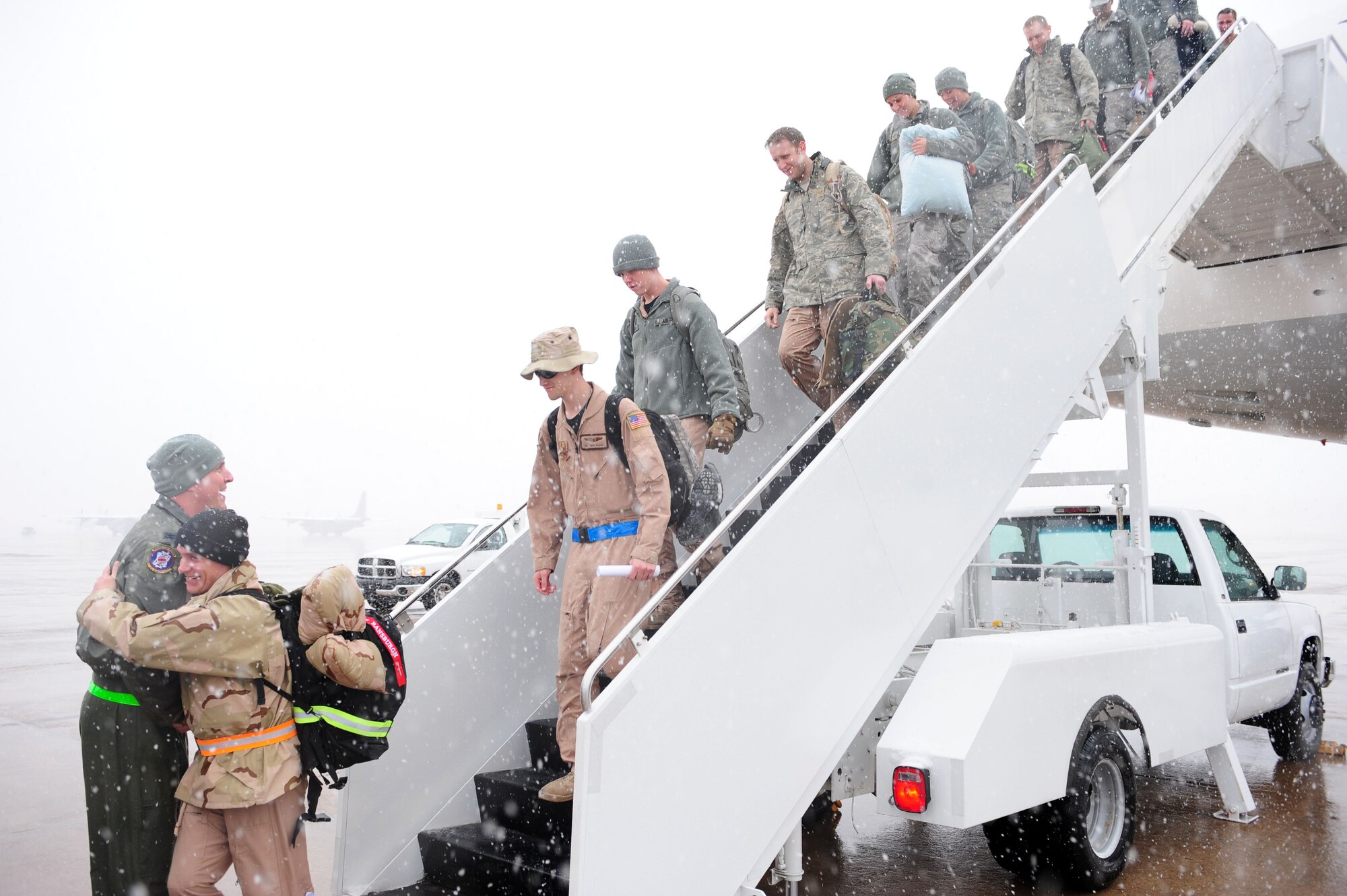 Col. Mike Minihan, 19th Airlift Wing commander, greets Team Little Rock members returning home from deployment Jan. 20, 2011, at Little Rock Air Force Base, Ark. The Airmen returned from various deployed locations, such as Afghanistan, Iraq and Kuwait. (U.S. Air Force photo by Senior Airman Jim Araos)