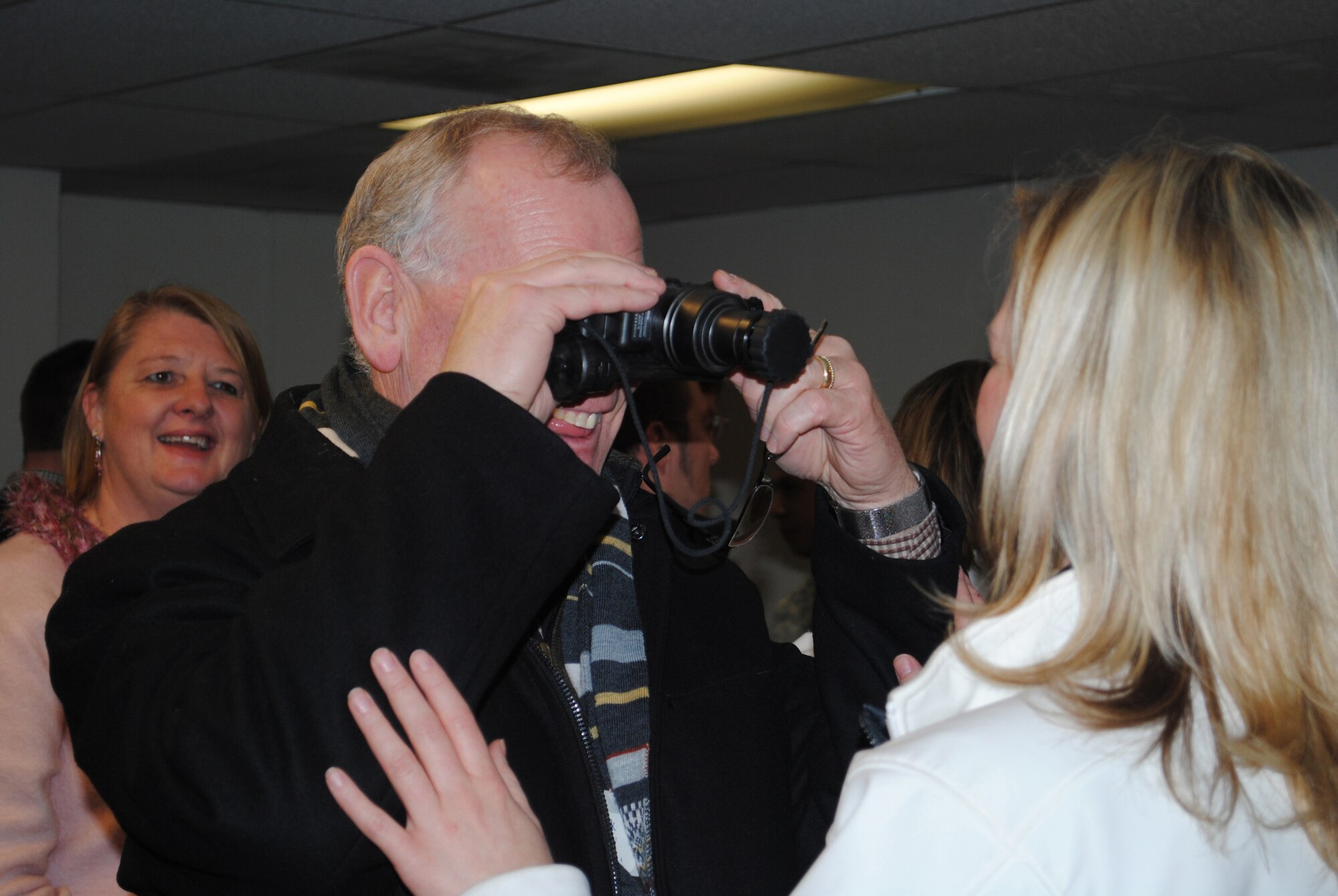 A member of this years Leadership Montana class tests out Security Forces night-vision goggles.  Their tour included a demonstration of various equipment used by Security Forces members. (U.S. Air Force photo/Airman Cortney Hansen)
