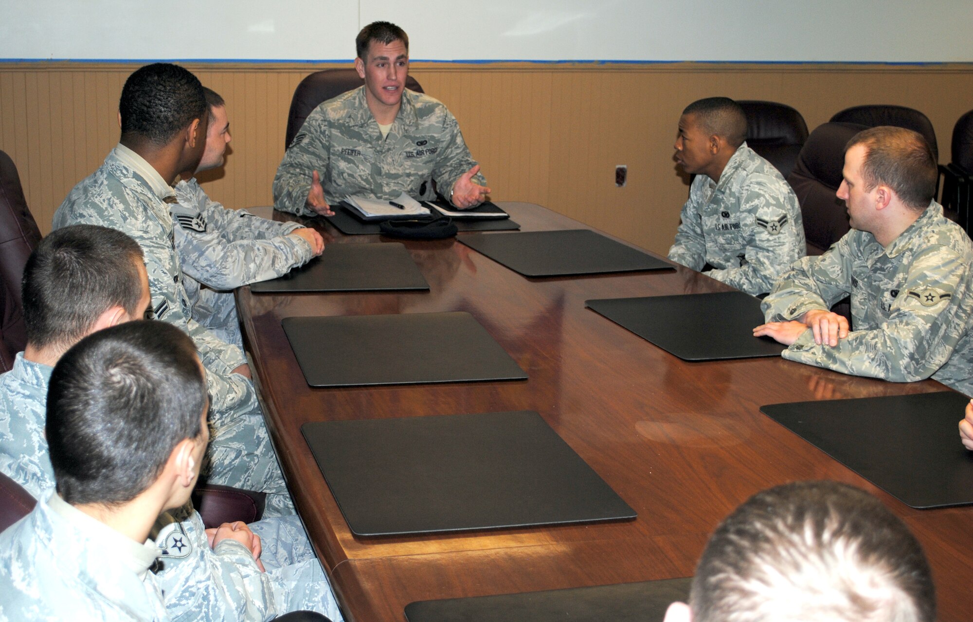 Staff Sgt. Ryan Pfeifer talks with junior Airmen of the security forces squadrons here anout the rewards of the career field he has experienced. Sergeant Pfeifer is a member of the 791st Missile Security Forces Squadron at Minot Air Force Base, N.D., and was named as one of the 12 Outstanding Airmen of the Year for fiscal year 2011 and appointed to address Airmen issues and concerns with Air Force Global Strike Command. (U.S. Air Force photo/Airman 1st Class Kristina Overton)