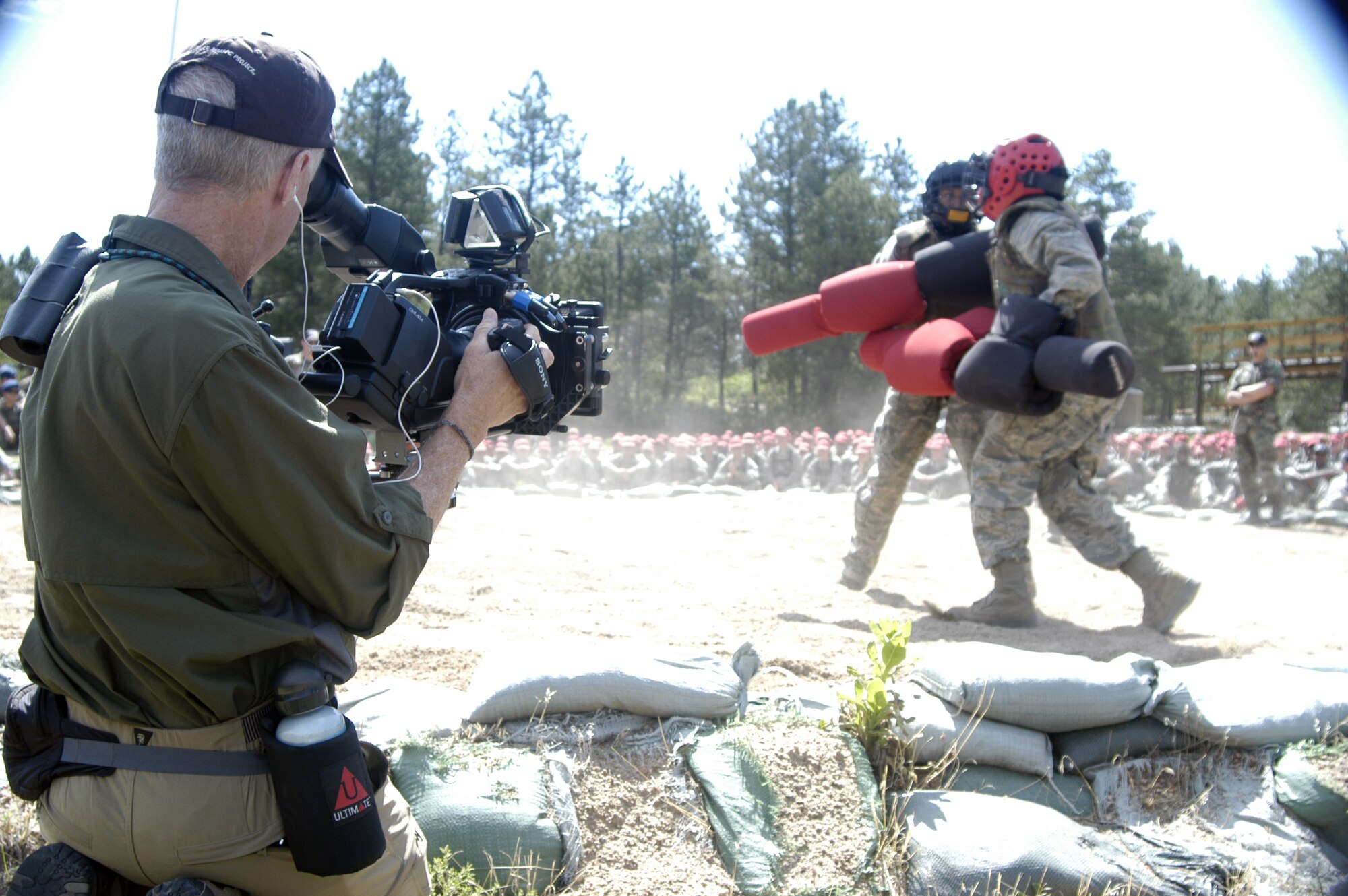 Edward Done films the final portions of Second Basic Cadet Training in Jacks Valley at the Air Force Academy July 24, 2010. Mr. Done is the director of photography for the Wings of Honor film crew, which is creating a documentary about cadet life focused on Cadet Squadron 10. (U.S. Air Force photo/John Van Winkle)