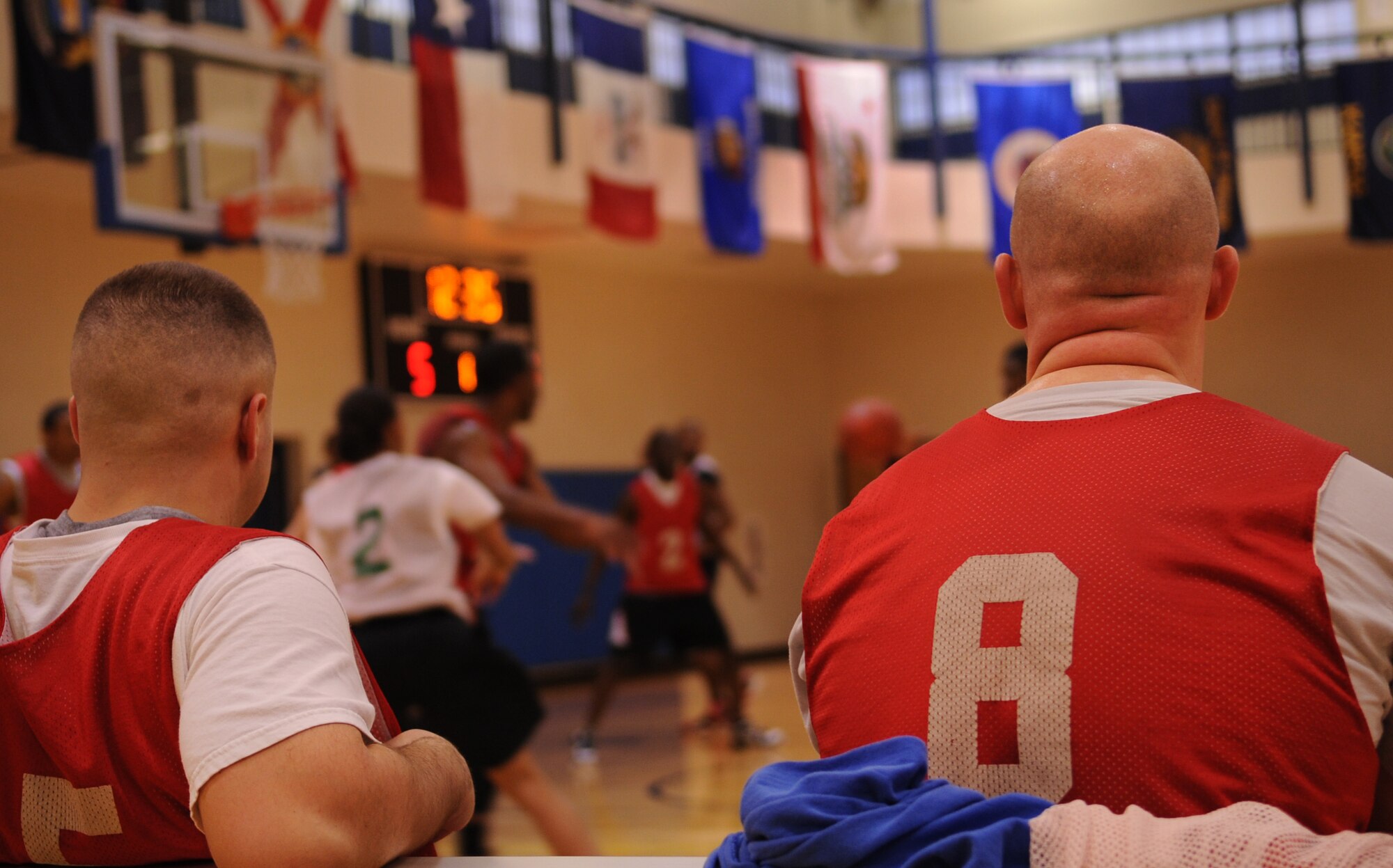 MOODY AIR FORCE BASE, Ga. -- Donald Thibideau and Shane Wallace watch as their team, 23rd Component Maintenance Squadron, plays defense against the 822nd Base Defense Squadron Jan. 19. Though they had players to substitute, they still ended with a disappointing loss with a final score of 50-35. (U.S. Air Force photo/Airman 1st Class Douglas Ellis)(RELEASED)

