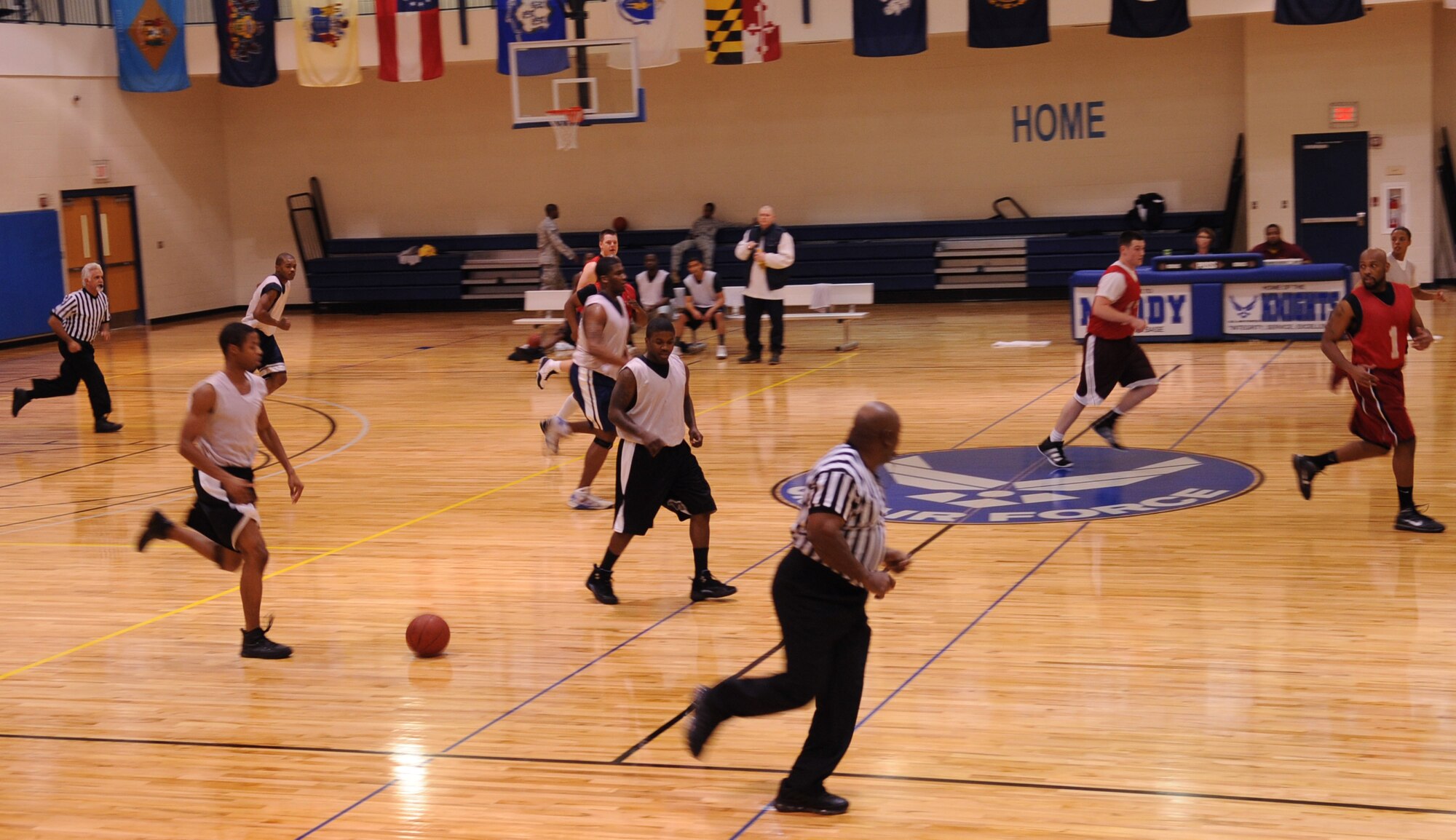 MOODY AIR FORCE BASE, Ga. -- A Member of the 822nd Base Defense Squadron brings the ball up the court during an intramural basketball game Jan. 19. This game was between the 820th Base Defense Group who won against the 23rd Component Maintenance Squadron 50-35. (U.S. Air Force photo/Airman 1st Class Douglas Ellis)(RELEASED)

