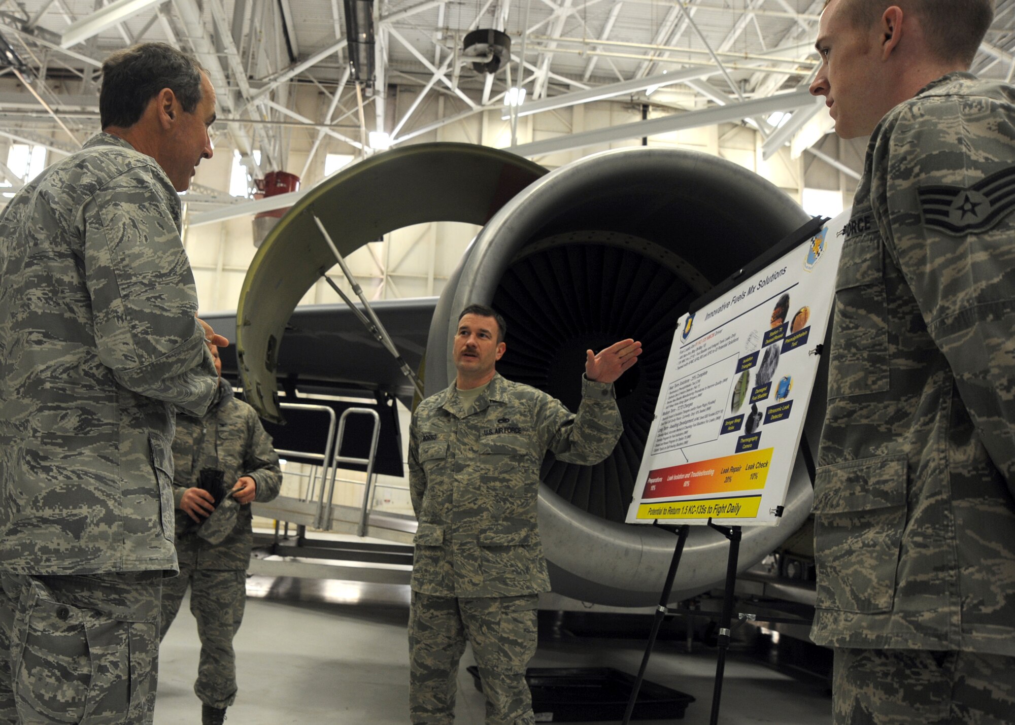 Master Sgt. Andrew Borko, 22nd Maintenance Squadron assistant NCOIC of aircraft fuel systems, briefs Gen. Raymond Johns Jr., Air Mobility Command commander, on the aircraft fuel systems of a KC-135 Stratotanker, Jan. 13, 2011, McConnell Air Force Base, Kan. General Johns received and a close - up look at the 22nd Air Refueling Wing mission and visited McConnell Airmen. (U.S. Air Force photo/Staff Sgt. Dallas Edwards)
