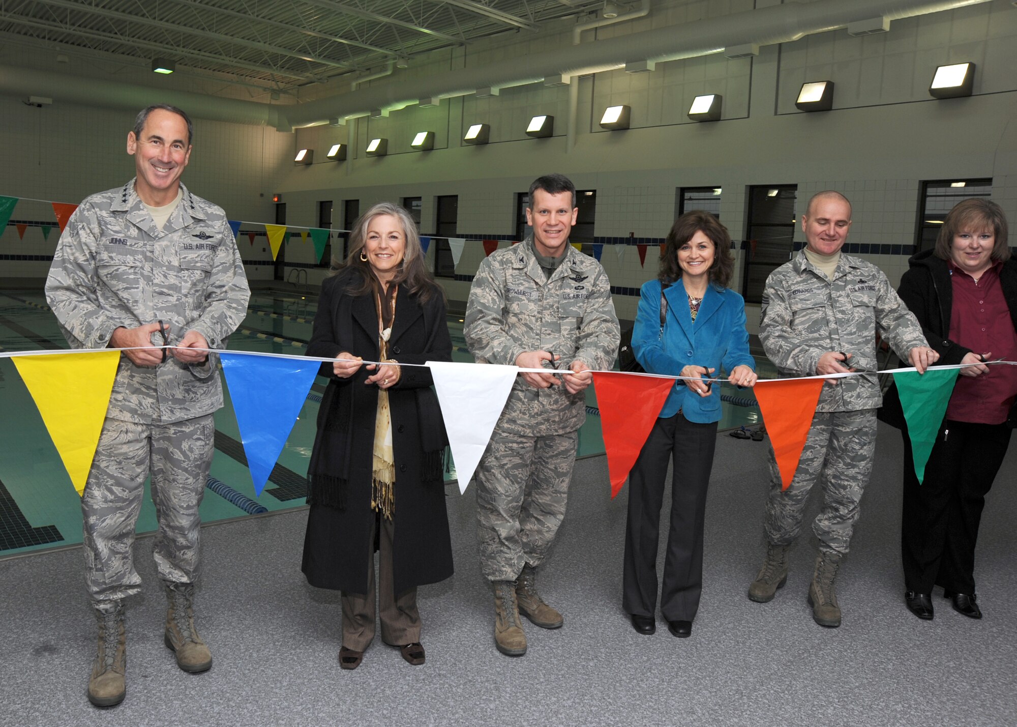 Gen. Raymond Johns Jr., Air Mobility Command commander, his wife Diana Johns, Col. Jamie Crowhurst, 22nd Air Refueling Wing commander, his wife Lisa Crowhurst, Chief Master Sgt. Michael Edwards, 22nd ARW command chief, and his wife Carla Edwards, participate in a ribbon cutting ceremony for the refurbished indoor pool at the base fitness center, Jan. 11, 2011, McConnell Air Force Base, Kan. (U.S. Air Force photo/Staff Sgt. Dallas Edwards)