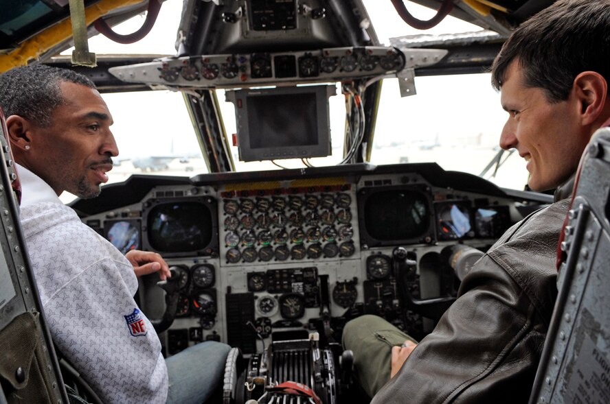 Capt. Beau Blanc (right), 20th Bomb Squadron B-52 pilot, informs Michael Lewis, New Orleans Saints football team ambassador and former player, about the inner workings of the flight deck and B-52H Stratofortress Jan. 19 at Barksdale Air Force Base, La. Mr. Lewis visited Barksdale with the Saints' 2010 Lombardi Super BowlTrophy to sign autographs and to meet and greet Airmen. (U.S. Air Force photo/Staff Sgt. John Gordinier)