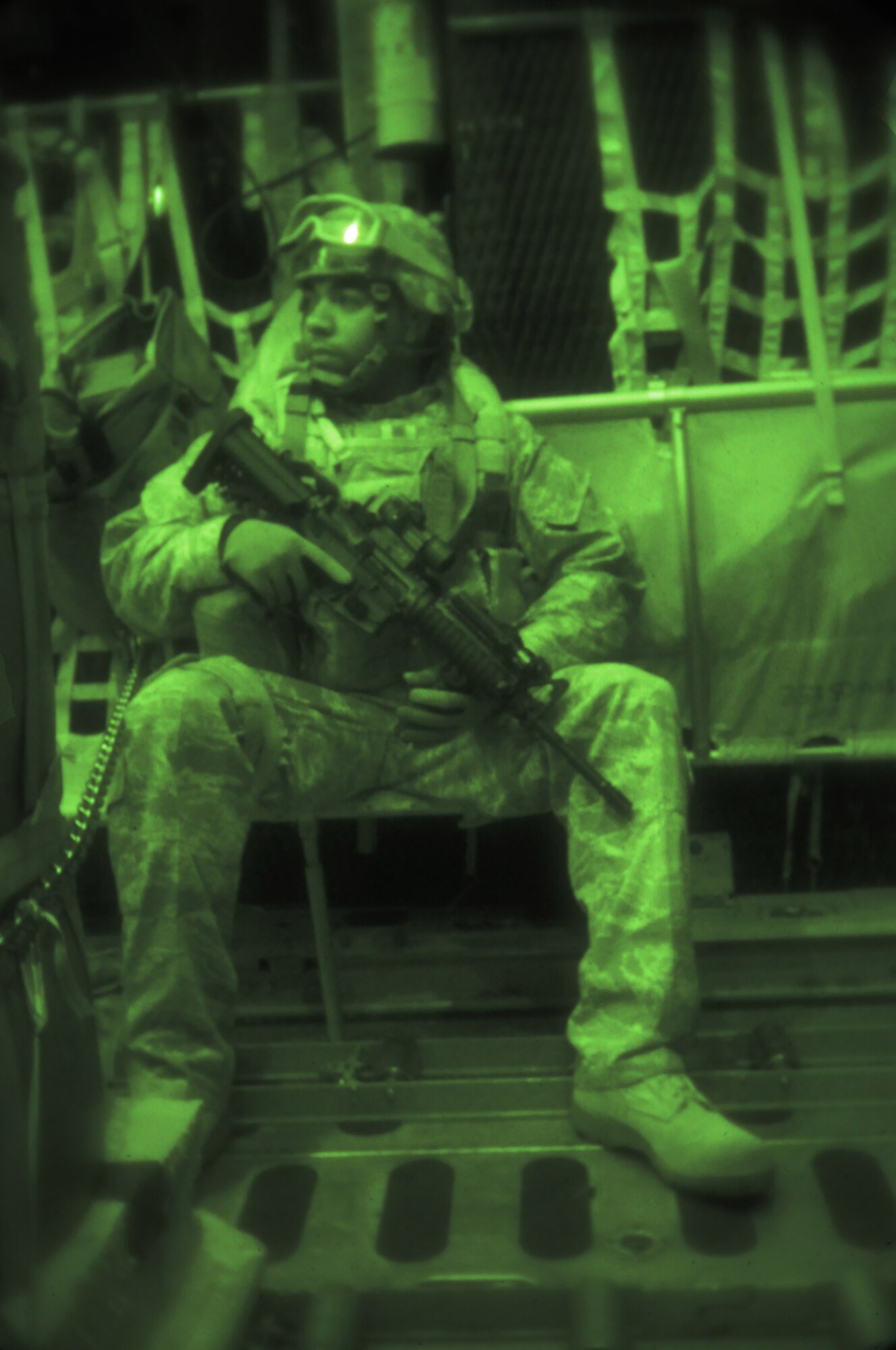IE SHIMA AIRFIELD, Japan -- Staff Sgt. Julian Taylor, a fly-away security team leader with the 353rd Special Operations Support Squadron, sits ready to depart a MC-130P Combat Shadow during an exercise to test the Security Forces Flight's ability to provide fly-away security for an aircraft and medical personnel at an airfield in "hostile" territory here Jan. 19 as part of Beverly High 11-02, a local operational readiness exercise. The scenario was the first time the Security Forces Flight tested their fly-away security capabilities during a local readiness exercise. Members of the 353rd Special Operations Group are participating in the exercise to hone their warfighting skills in preparation for a headquarters inspection next month. (U.S. Air Force photo by Tech. Sgt. Aaron Cram)