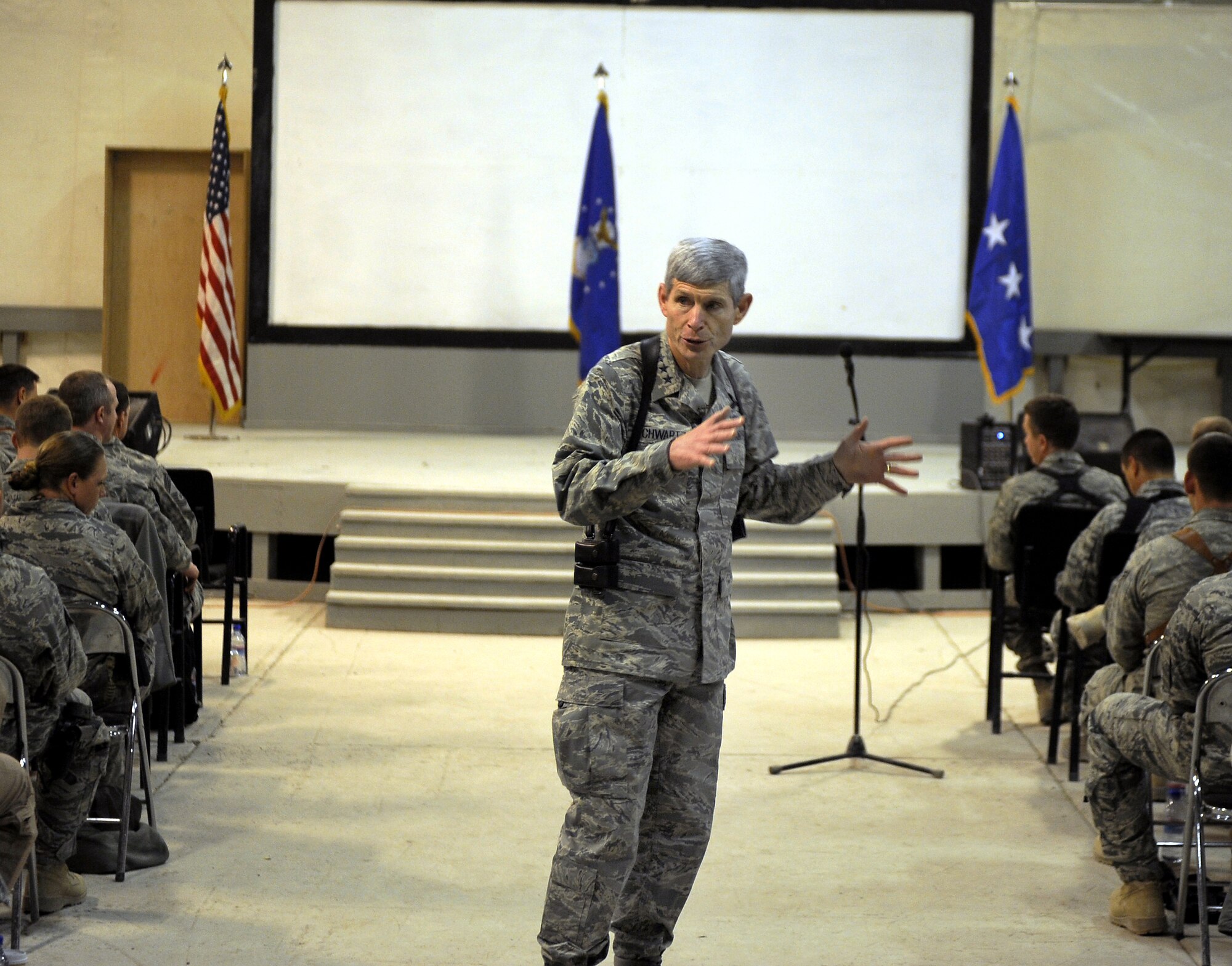 Gen. Norton A. Schwartz conducts a question-and-answer segment with Airmen Jan. 19, 2011, at Kandahar Airfield, Afghanistan. He addressed Airmen about manning, suicide prevention, and the Don?t Ask Don?t Tell policy repeal during an Airman?s call before answering questions from the Airmen ranging anywhere from commissioning to joint expeditionary taskings. General Schwartz is the chief of staff of the Air Force. (U.S. Air Force photo/Senior Airman Willard E. Grande II/Released)