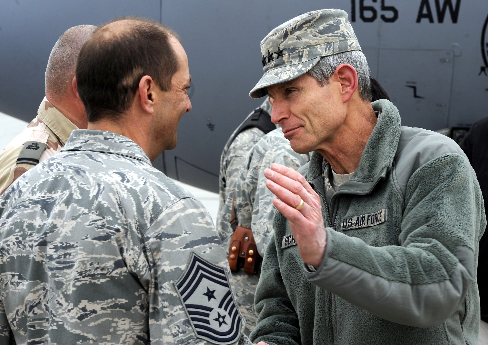Gen. Norton A. Schwartz greets Chief Master Sgt. Antonio Hickey Jan. 19, 2011, at Kandahar Airfield, Afghanistan He addressed Airmen about manning, suicide prevention, and the Don?t Ask Don?t Tell policy repeal during an Airman?s call before answering questions from the Airmen ranging anywhere from commissioning to joint expeditionary taskings. General Schwartz is the chief of staff of the Air Force and Chief Hickey is the 451st Air Expeditionary Wing command chief. (U.S. Air Force photo/Senior Airman Willard E. Grande II/Released)