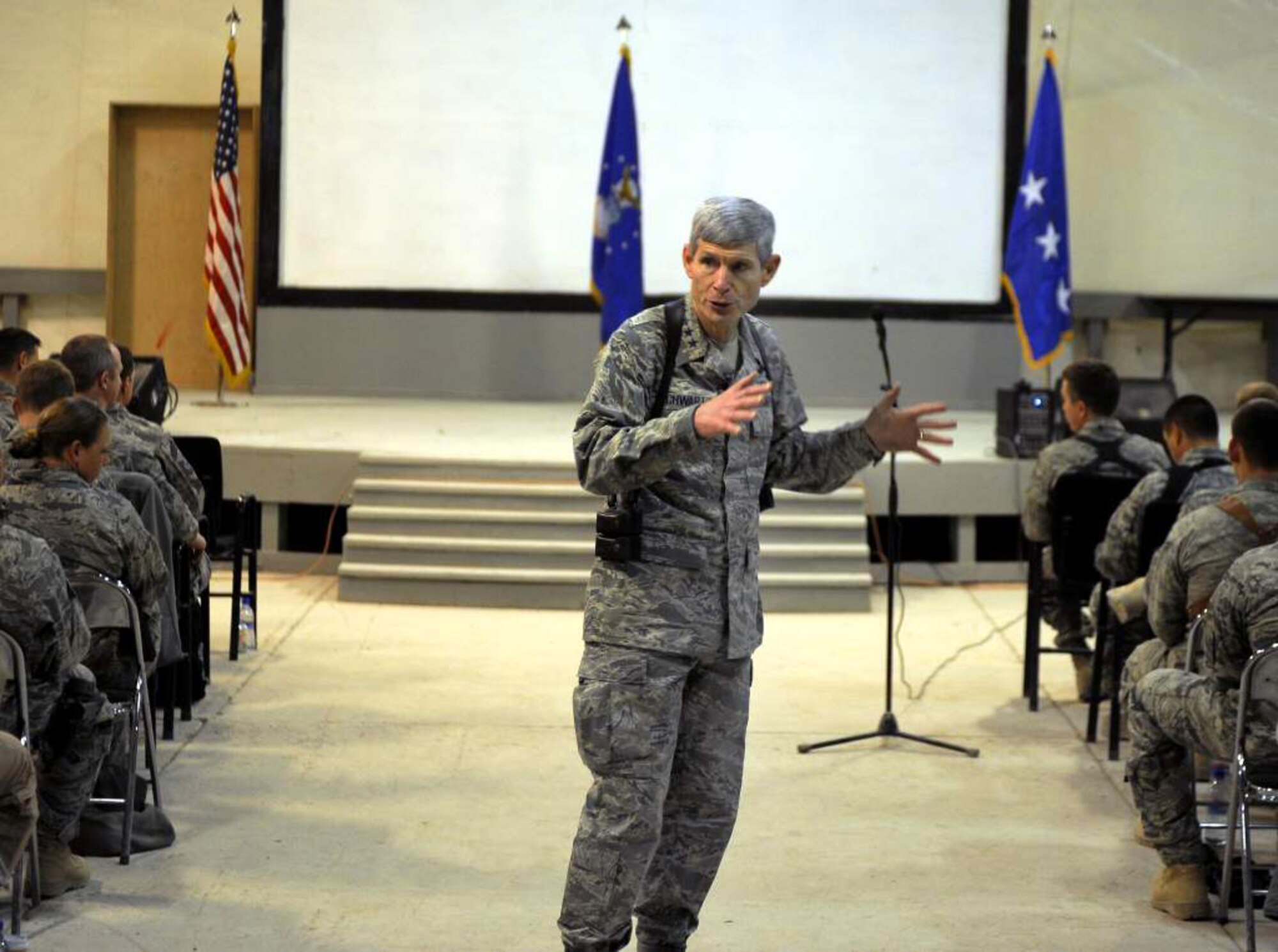 Air Force Chief of Staff Gen. Norton Schwartz takes questions from the audience during an “all call” Jan. 19, 2011, at Kandahar Airfield, Afghanistan. The general spoke to Airmen about manning, suicide prevention, and the repeal of Don’t Ask Don’t Tell. He also answered questions from the Airmen on topics ranging from commissioning opportunities to joint expeditionary taskings.  (U.S. Air Force photo/Senior Airman Willard E. Grande II)