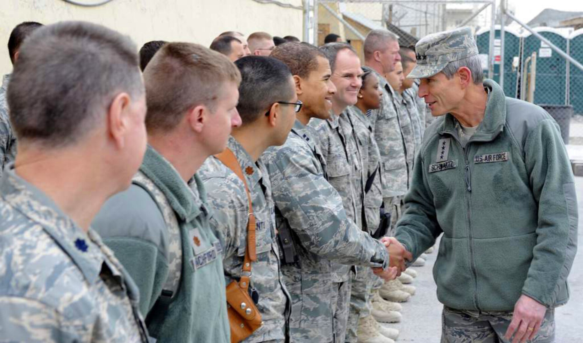 Air Force Chief of Staff Gen. Norton Schwartz shakes hands with Airmen Jan. 19, 2011, at Kandahar Airfield, Afghanistan.  During an “all call,” the general spoke to Airmen about manning, suicide prevention, and the repeal of Don’t Ask Don’t Tell.  He also answered questions from the Airmen on topics ranging from commissioning opportunities to joint expeditionary taskings. (U.S. Air Force photo/Senior Airman Willard E. Grande II)